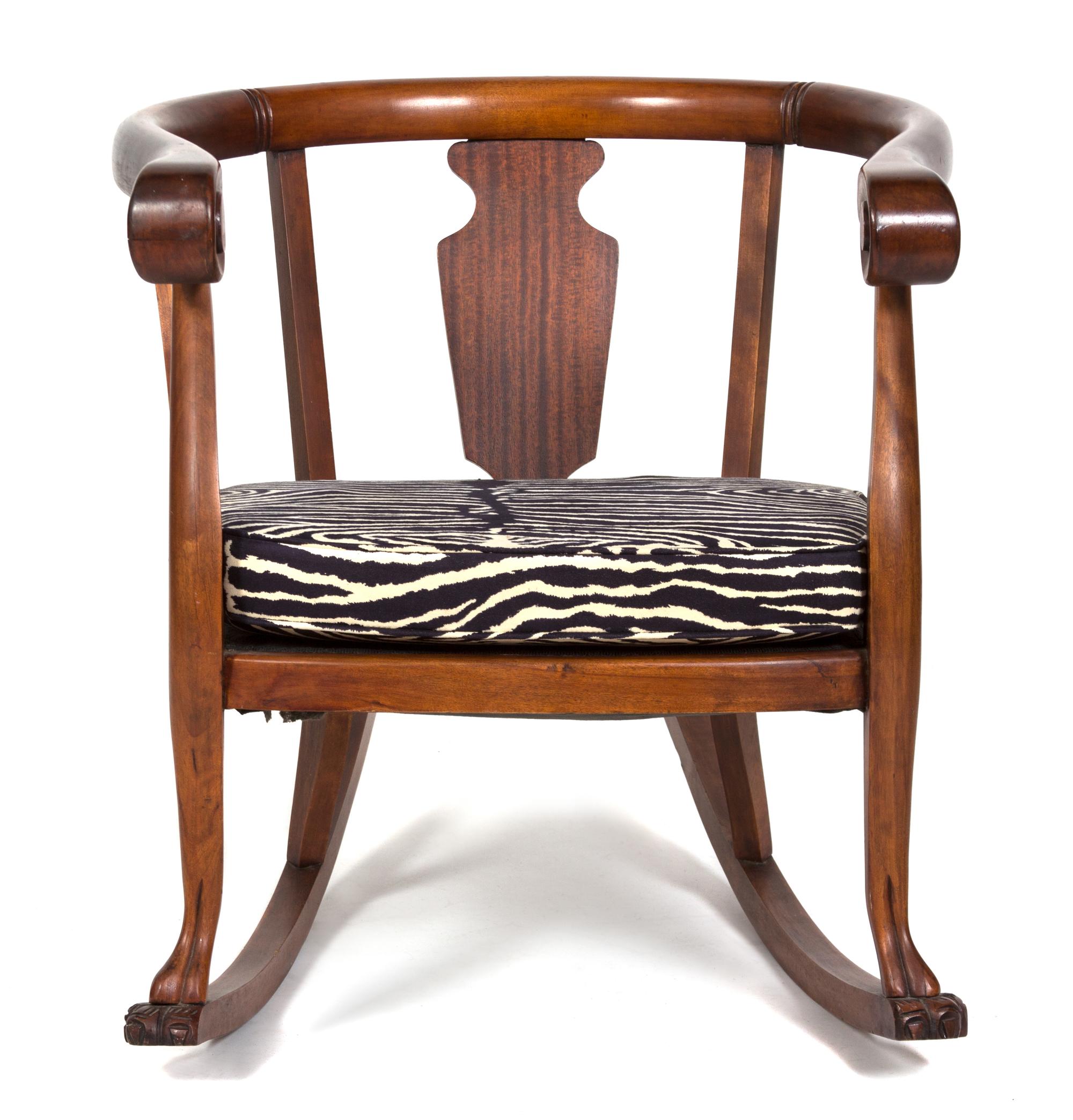 A British Colonial Mahogany Loveseat and Barrel-Back Rocking Chair Height of loveseat 32 x width 45 x depth 23 inches. — 20TH CENTURY