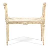 A Louis XVI Style Carved and Painted Cane Seat Window Bench Height 29 1/2 x length 30 inches. — LATE 19TH CENTURY