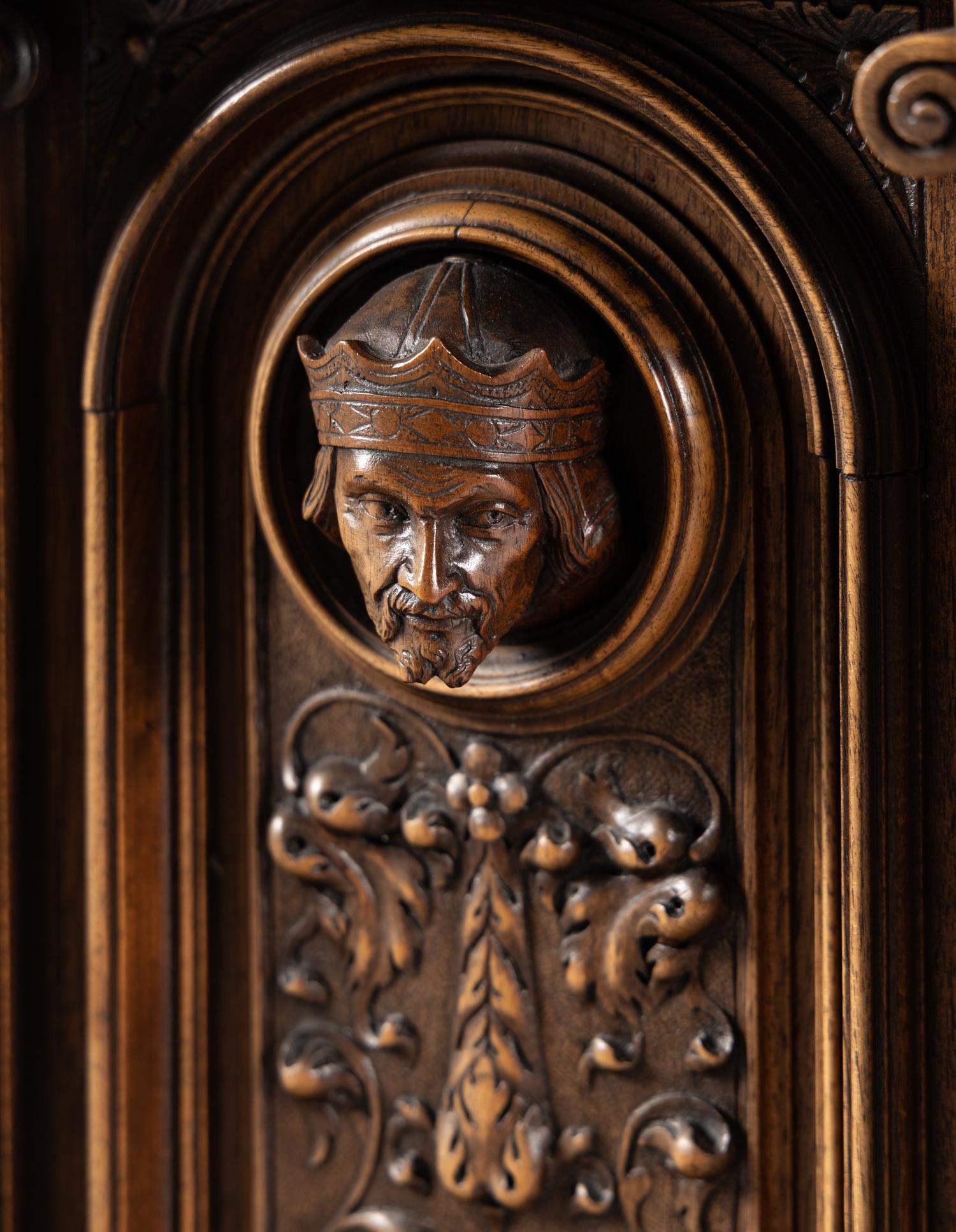 A Renaissance Revival Carved Walnut Marble-Top Cabinet