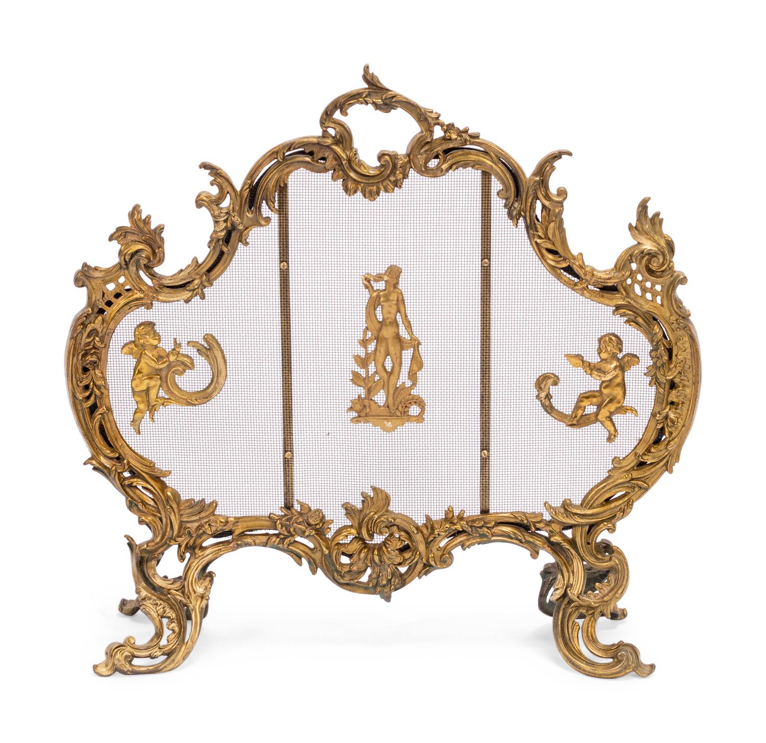 A Louis XV Style Gilt Bronze Four-Piece Fireplace Set