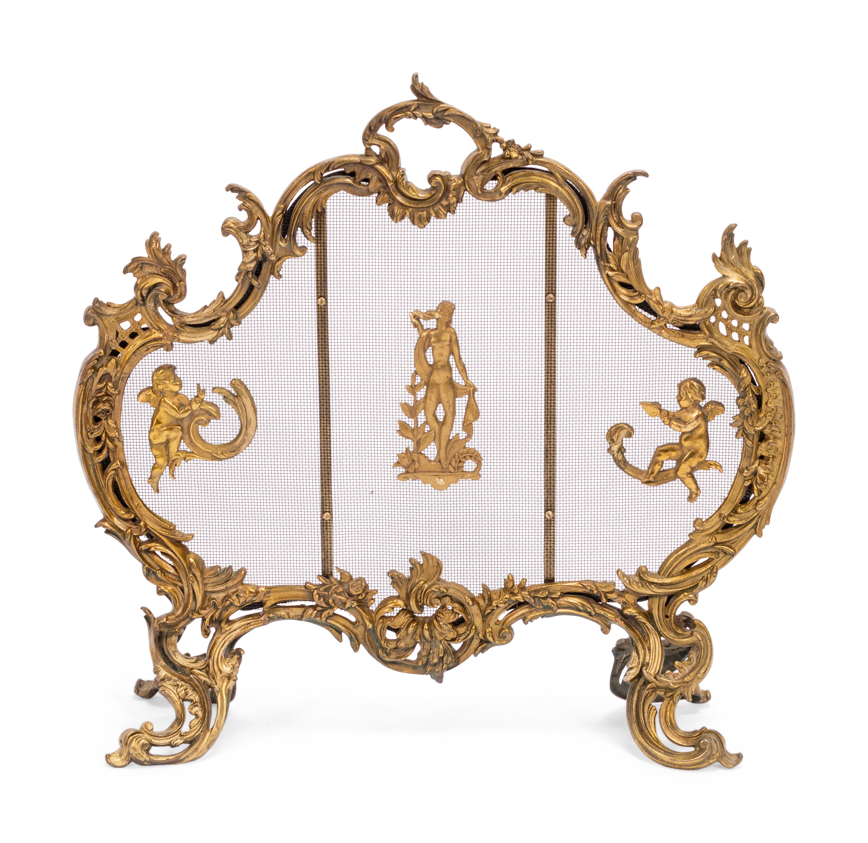 A Louis XV Style Gilt Bronze Four-Piece Fireplace Set