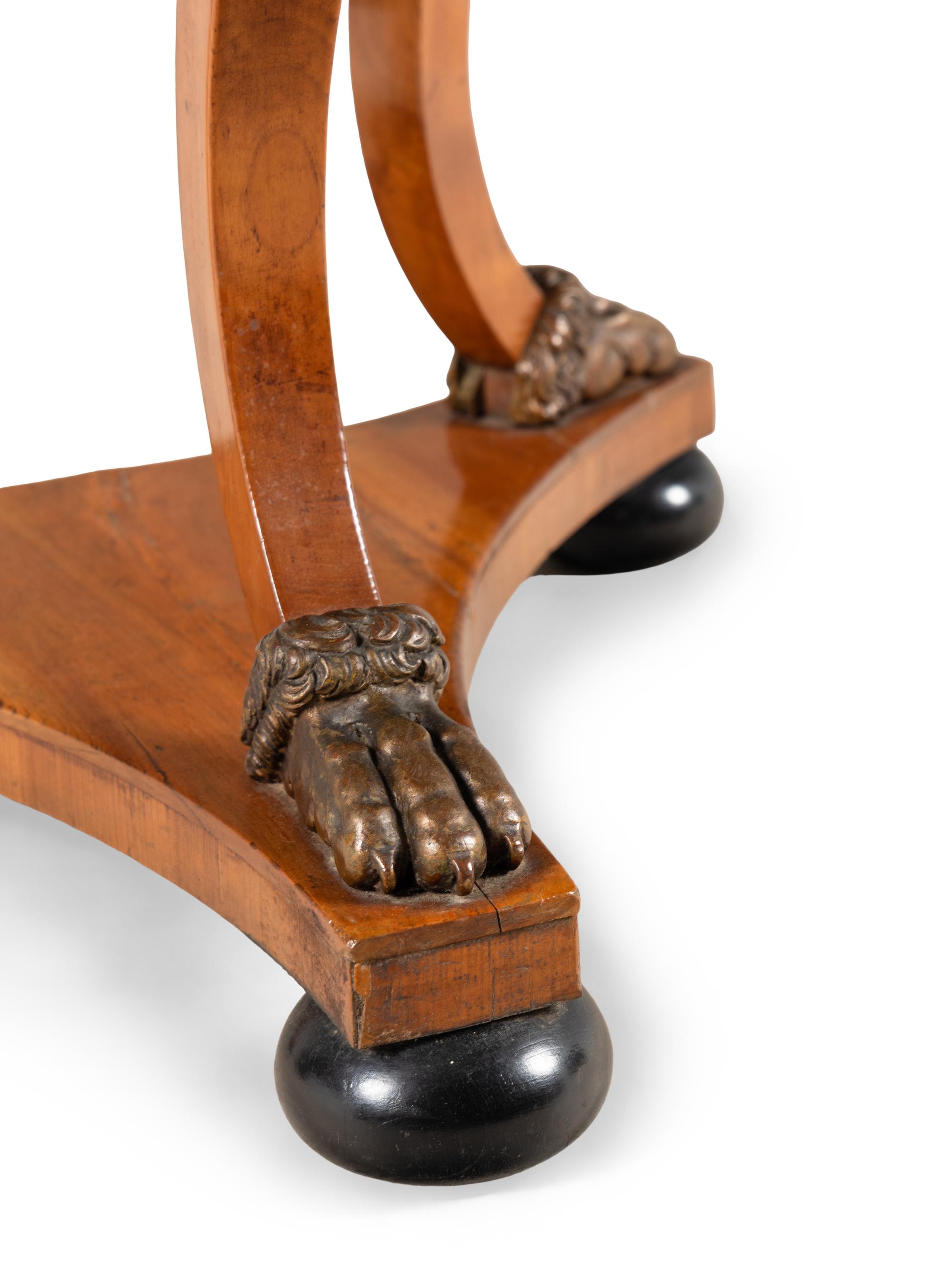 A Continental Parcel Ebonized Birch Marble-Top Center Table