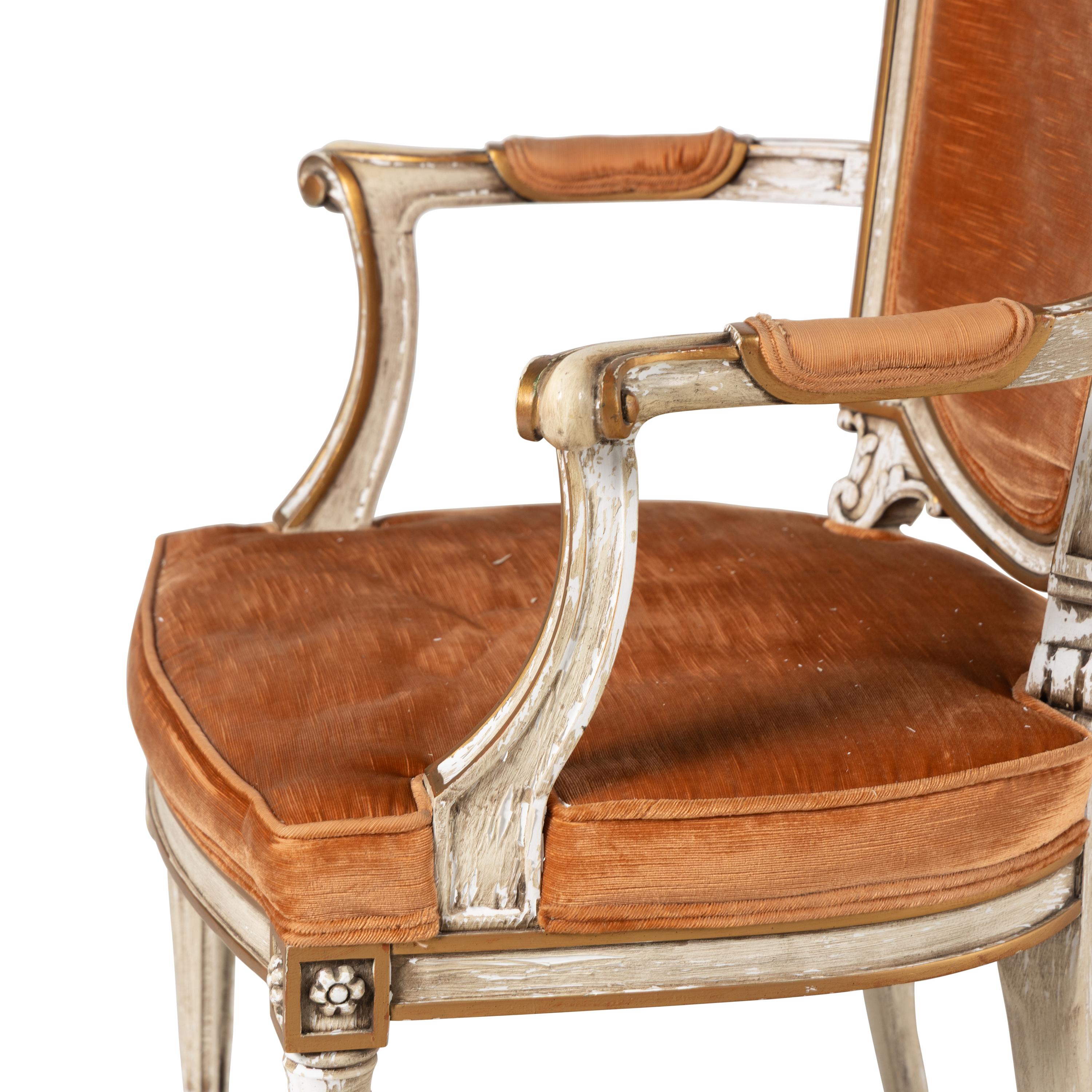 A Pair of Italian Crème-Painted and Parcel Gilt Armchairs