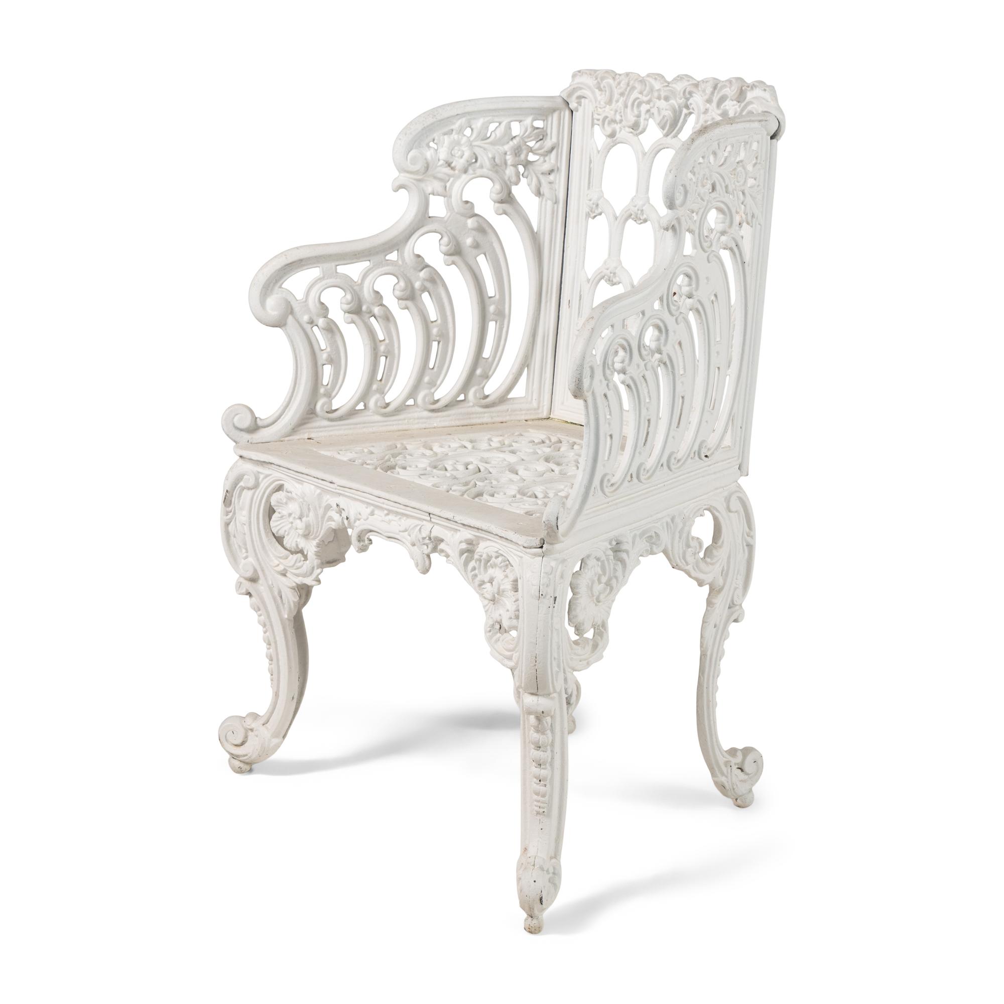 A White-Painted Cast Iron Three-Piece Garden Seating Suite