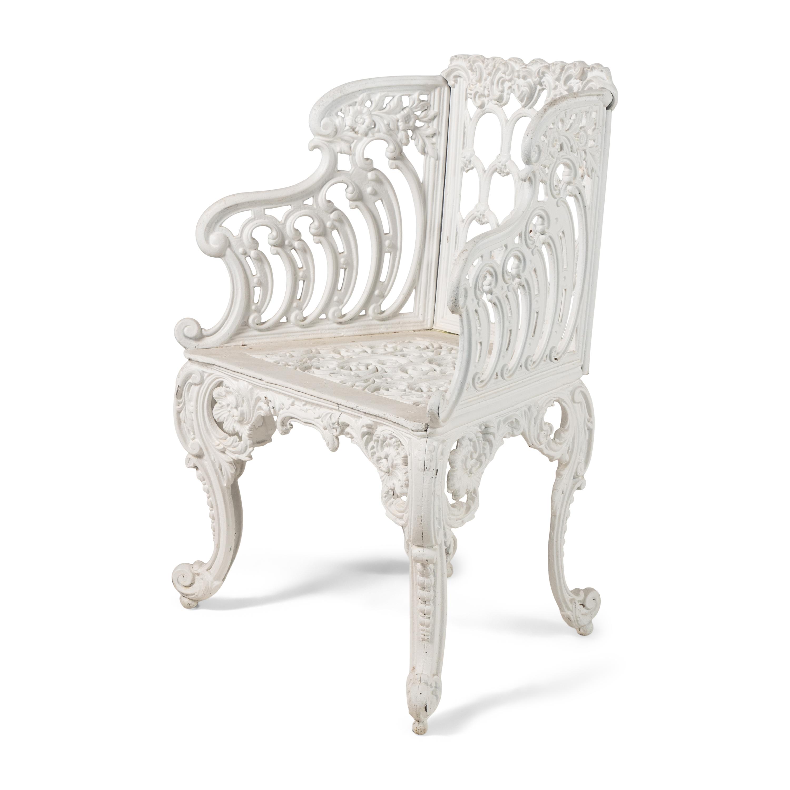 A White-Painted Cast Iron Three-Piece Garden Seating Suite