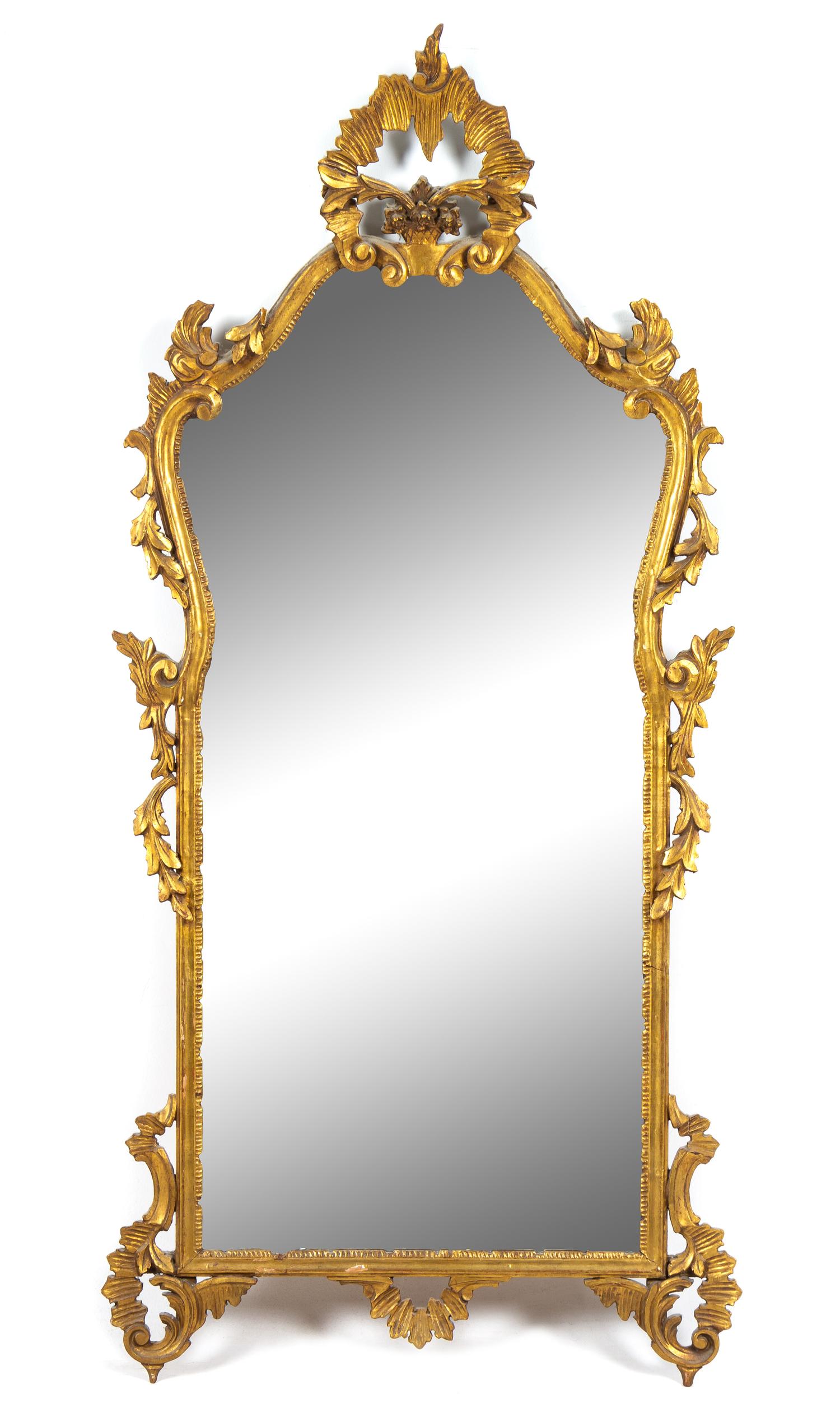 An Italian Baroque Style Giltwood Mirror