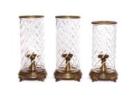 A Set of Three Brass and Cut Glass Hurricanes Height 18 3/4 inches. — 20TH CENTURY