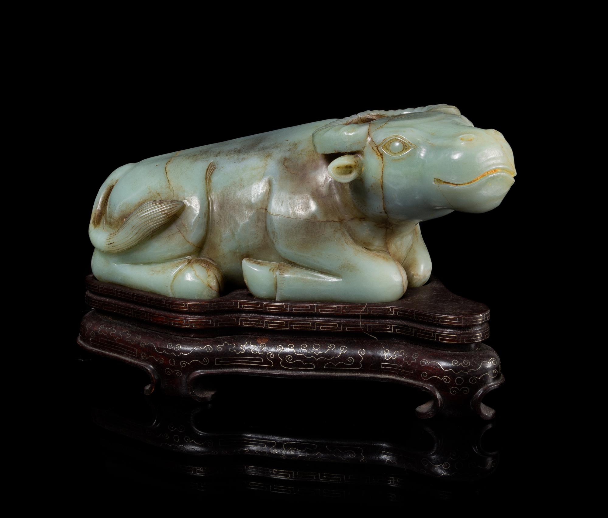 A Celadon Jade Figure of a Water Buffalo Length 14 1/4 inches.