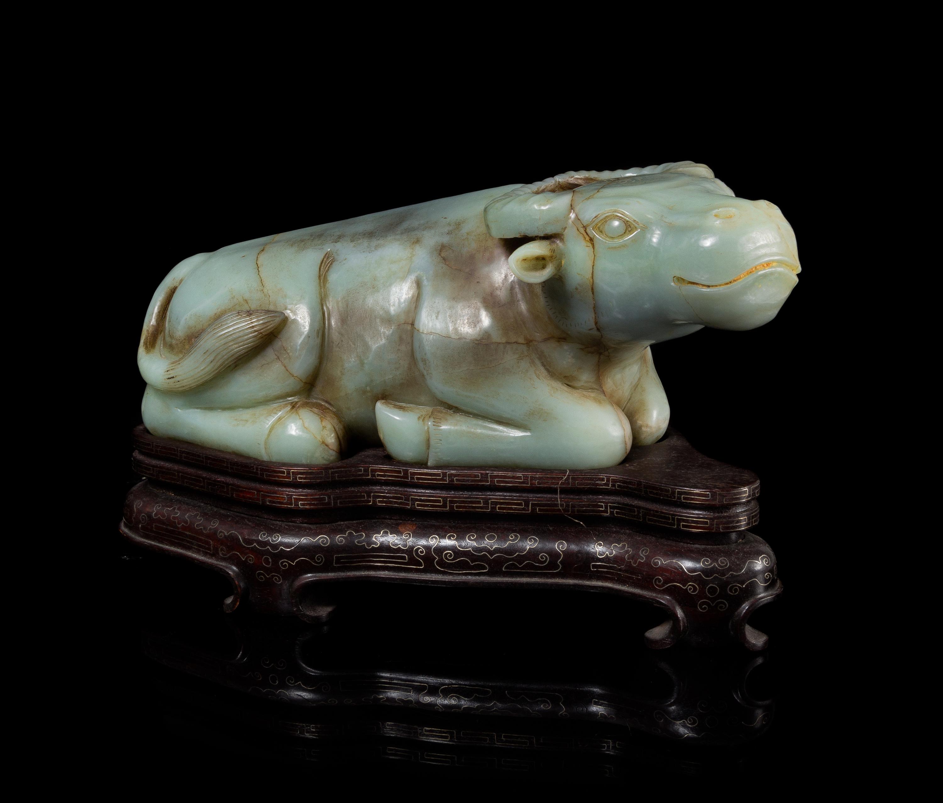 A Celadon Jade Figure of a Water Buffalo Length 14 1/4 inches.