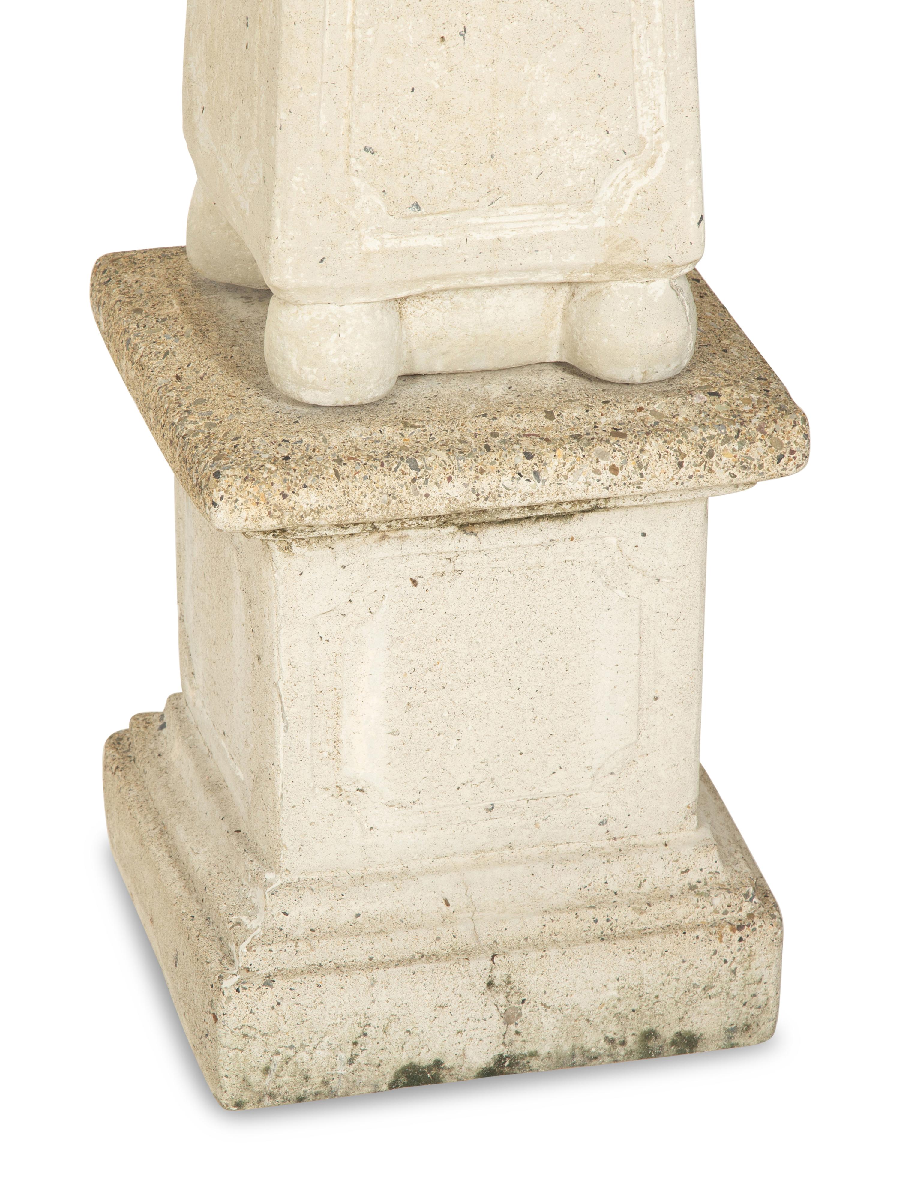 A Set of Four Cast Stone Obelisks