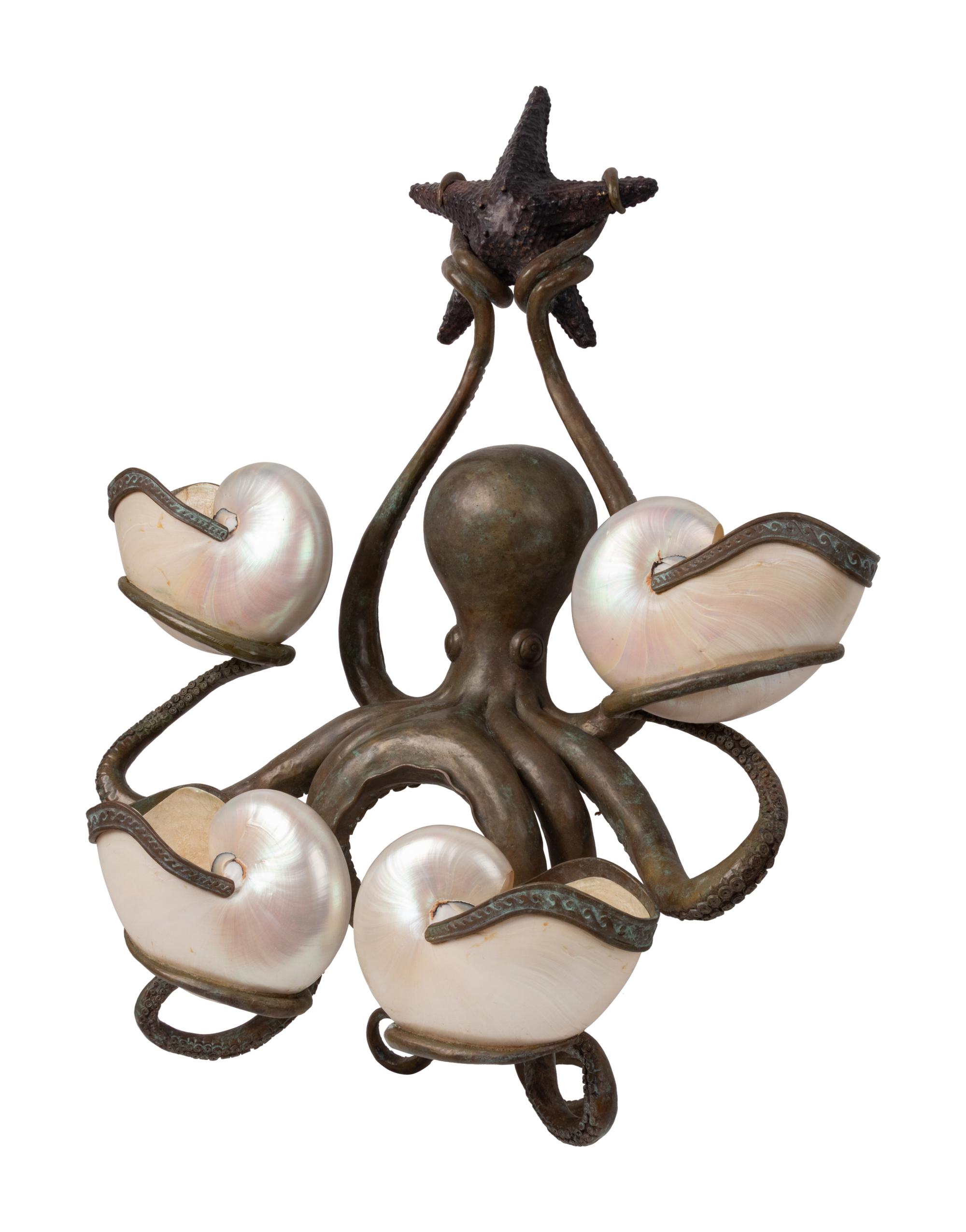 An Iron and Shell Mounted Sconce