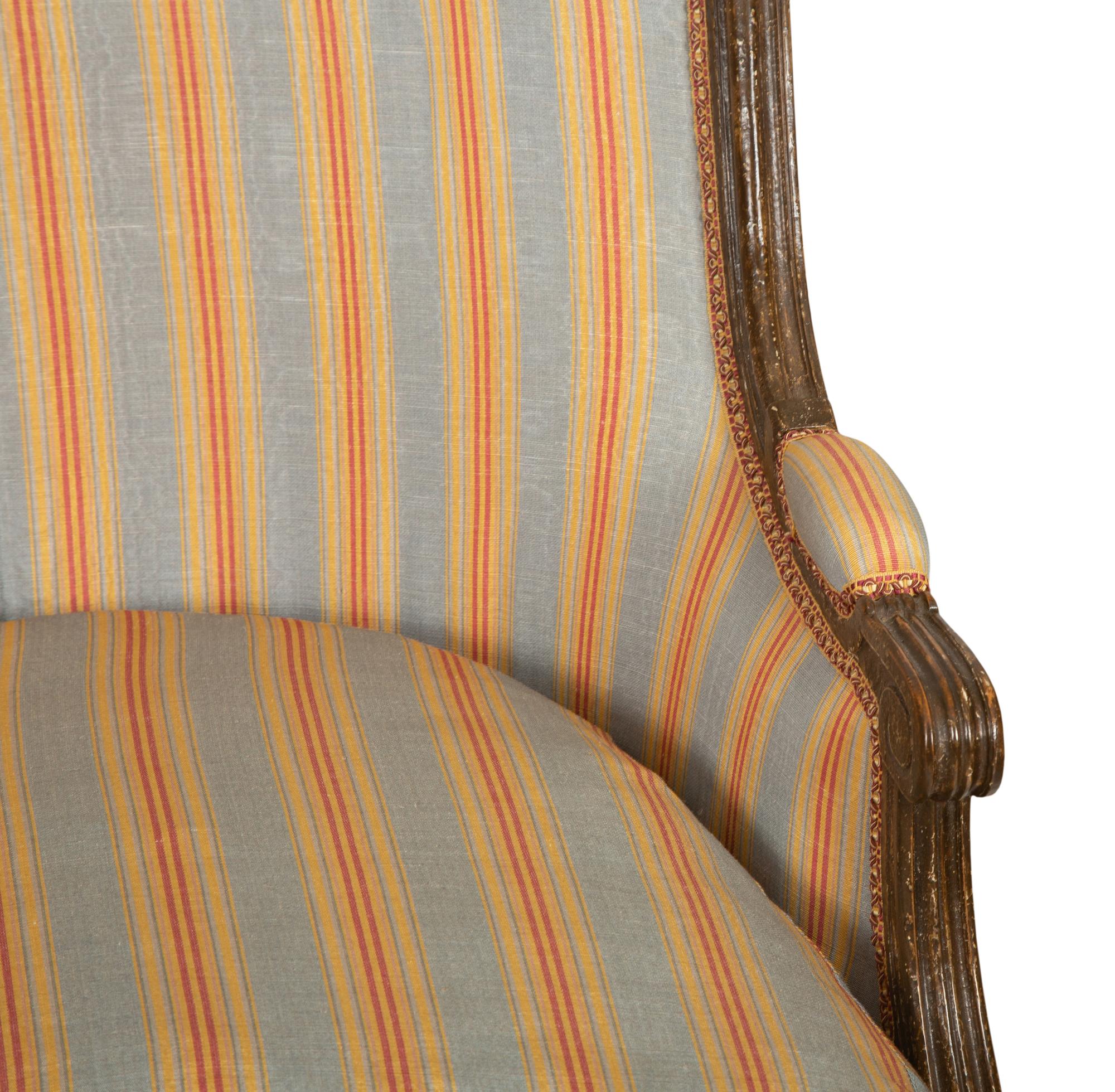 A Pair of Louis XVI Style Faux Finish Bergeres