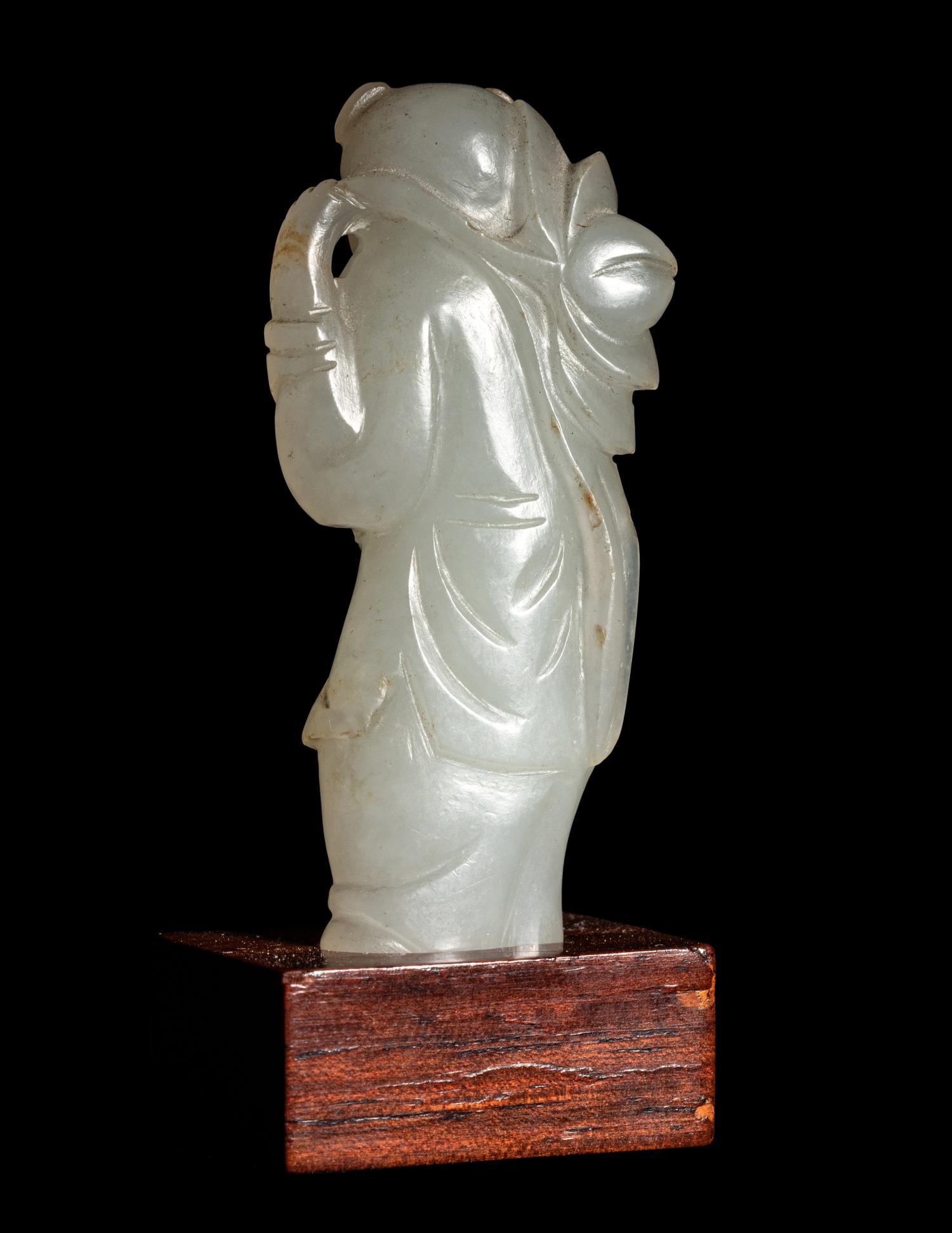 Two Carved Pale Celadon Jade Figures