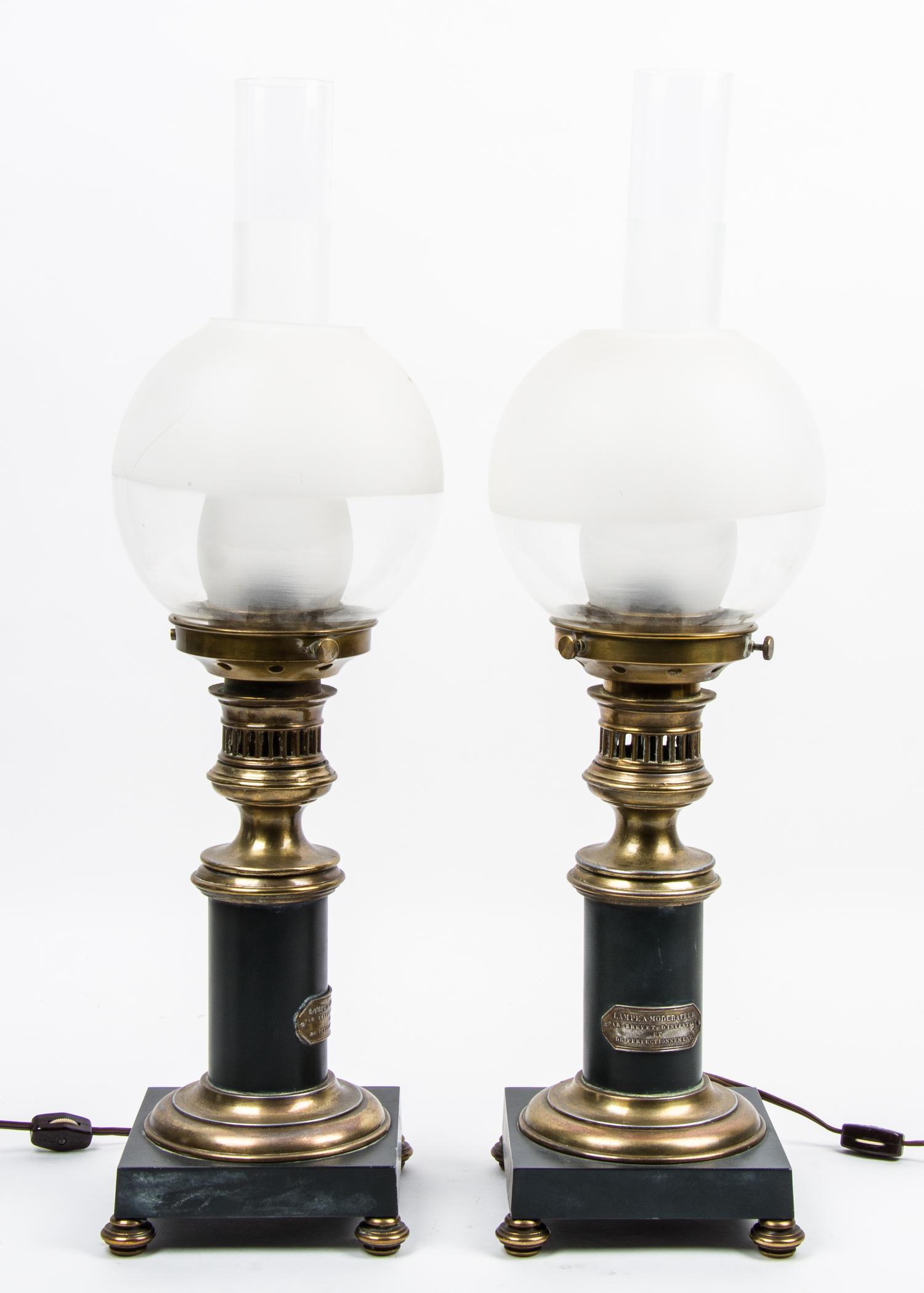 A Pair of French Gilt Brass Mounted Oil Lamps, Brevet Height 23 1/2 inches. — 19TH/20TH CENTURY