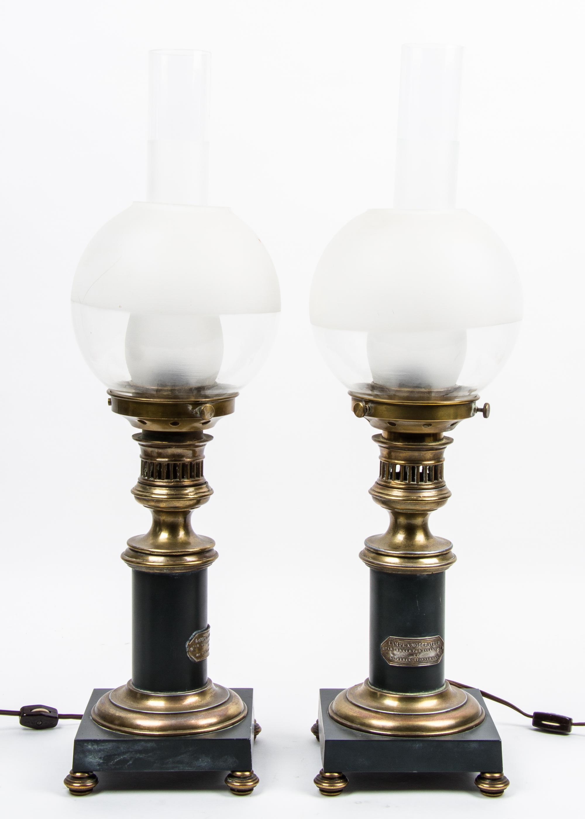 A Pair of French Gilt Brass Mounted Oil Lamps, Brevet Height 23 1/2 inches. — 19TH/20TH CENTURY