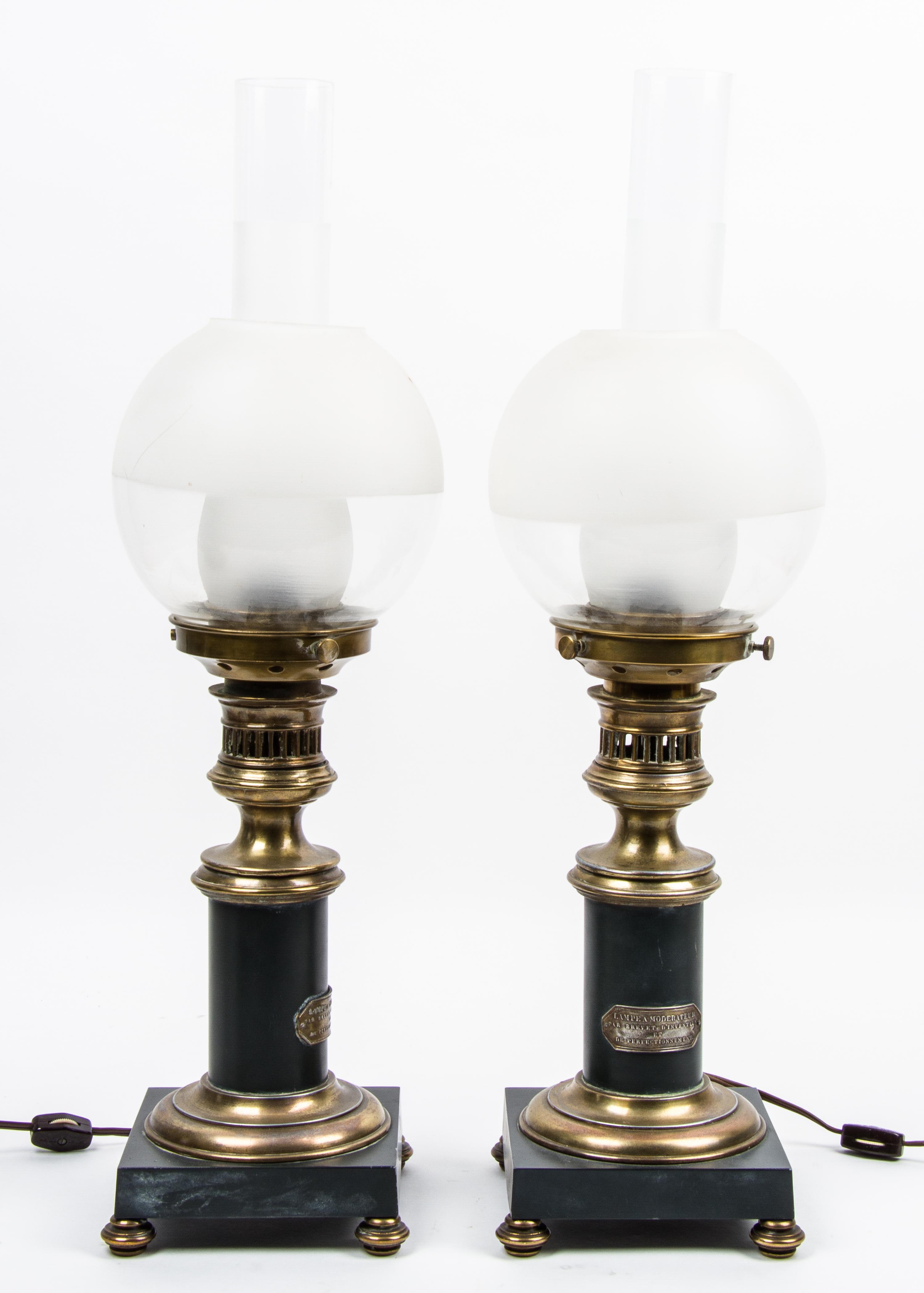 A Pair of French Gilt Brass Mounted Oil Lamps, Brevet Height 23 1/2 inches. — 19TH/20TH CENTURY
