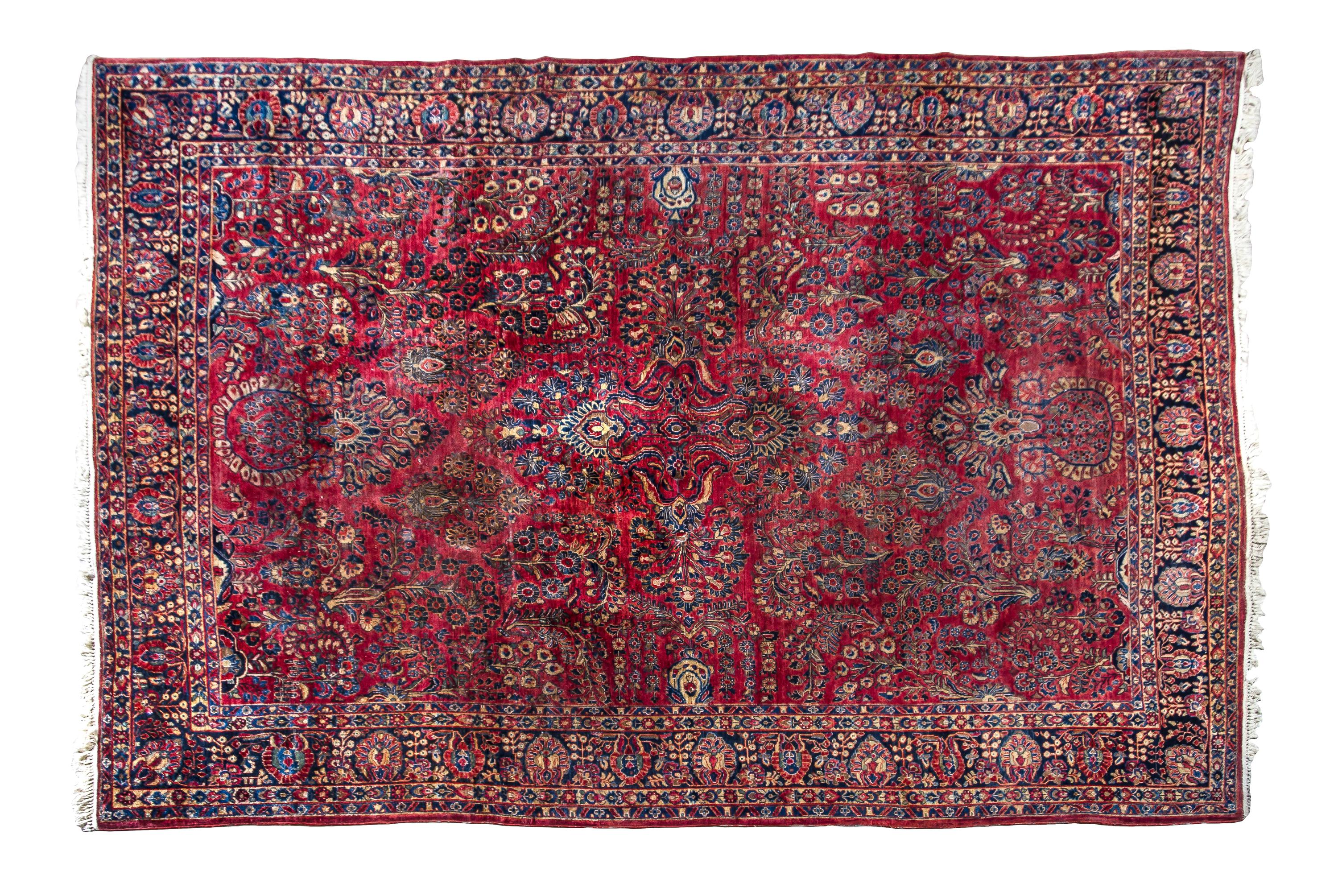 A Sarouk Wool Rug 11 feet 8 inches x 8 feet 6 inches.