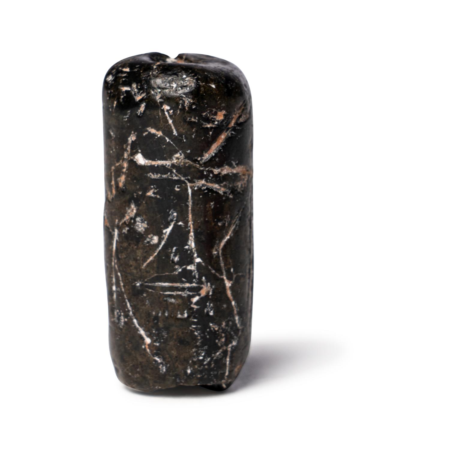 A Mesopotamian Black Steatite Cylinder Seal