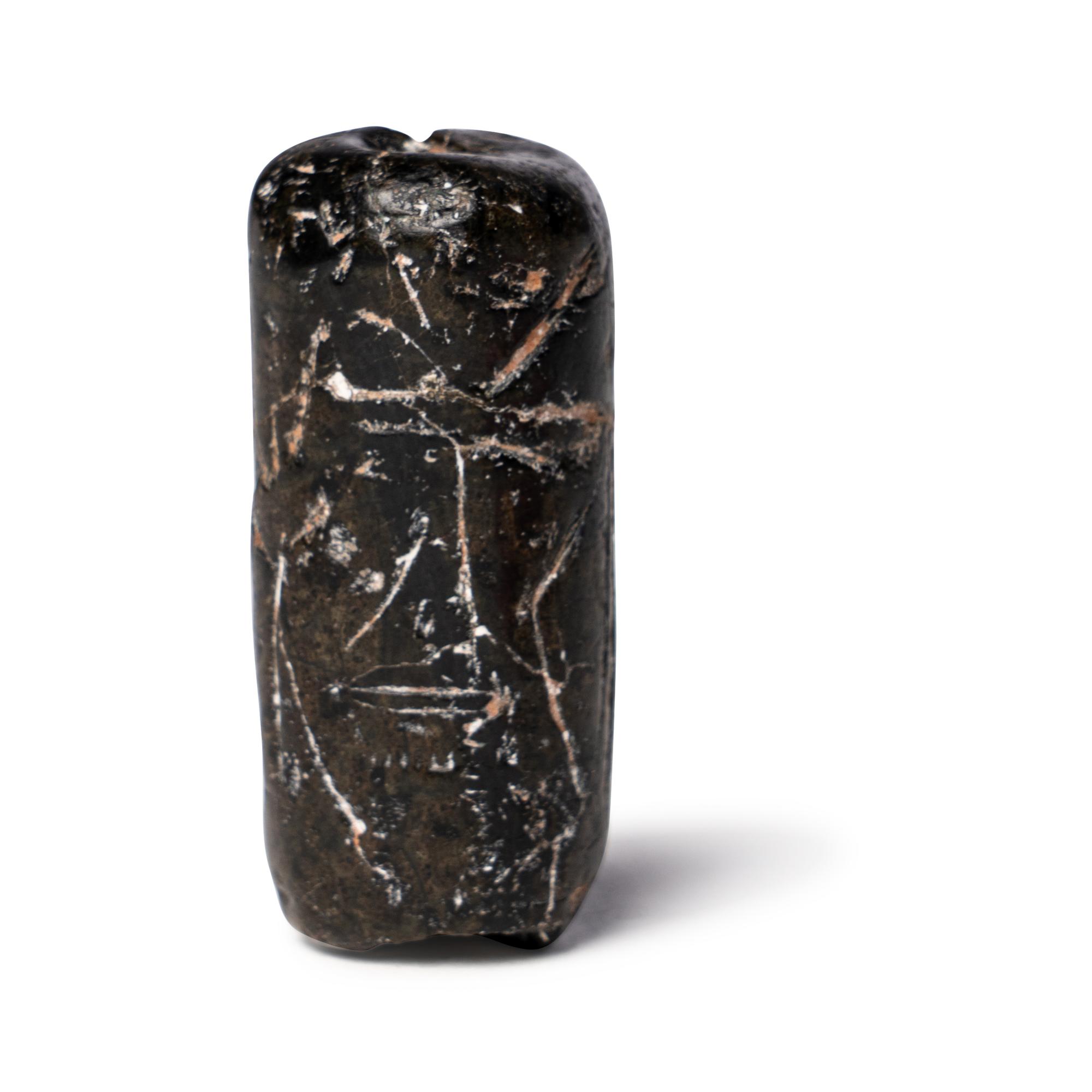 A Mesopotamian Black Steatite Cylinder Seal