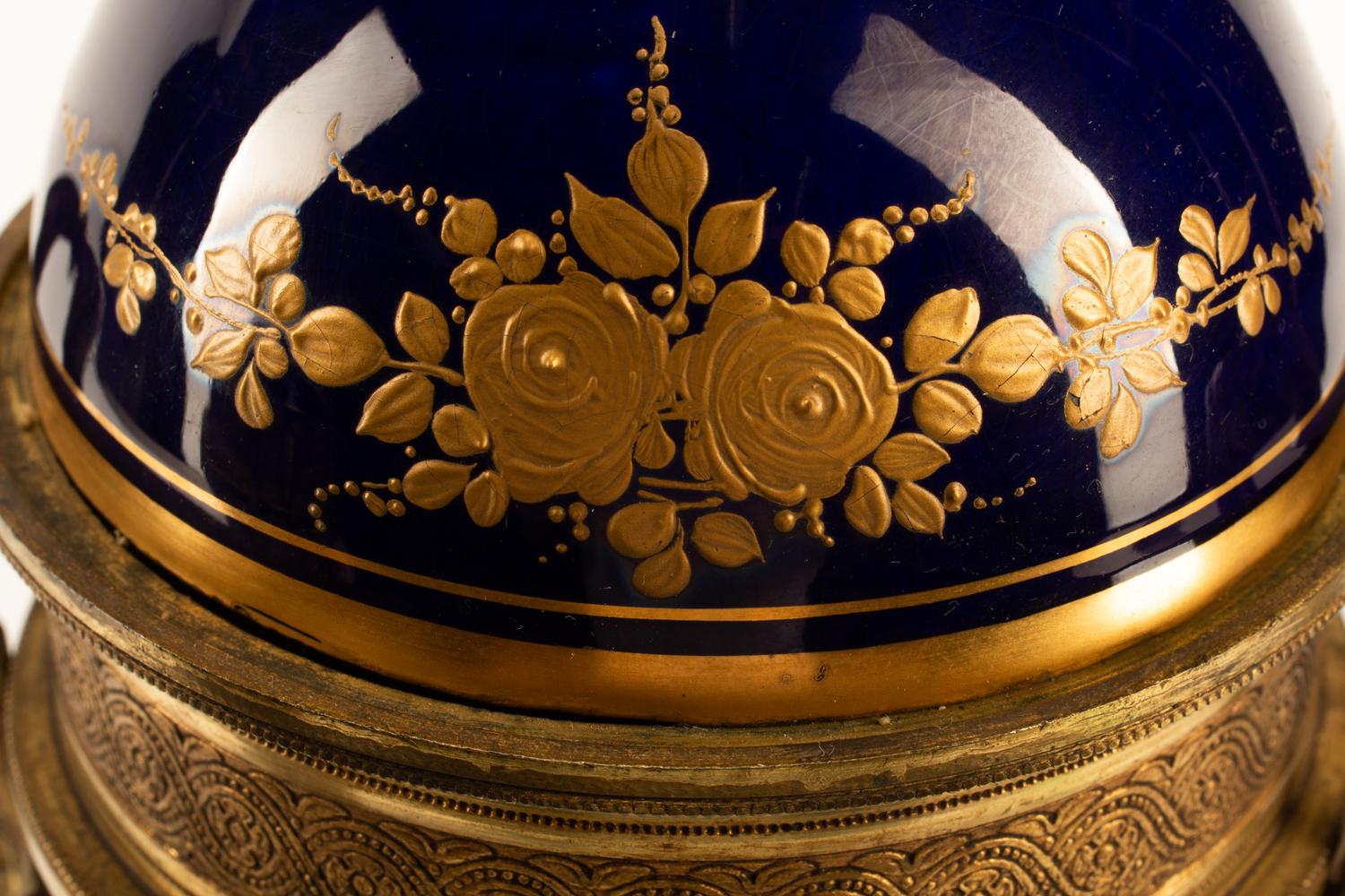 A Pair of Gilt Bronze Mounted Sèvres Style Porcelain Urns