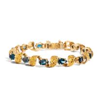 YELLOW GOLD AND BLUE TOPAZ BRACELET