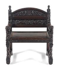 A William and Mary Style Carved Walnut Armchair