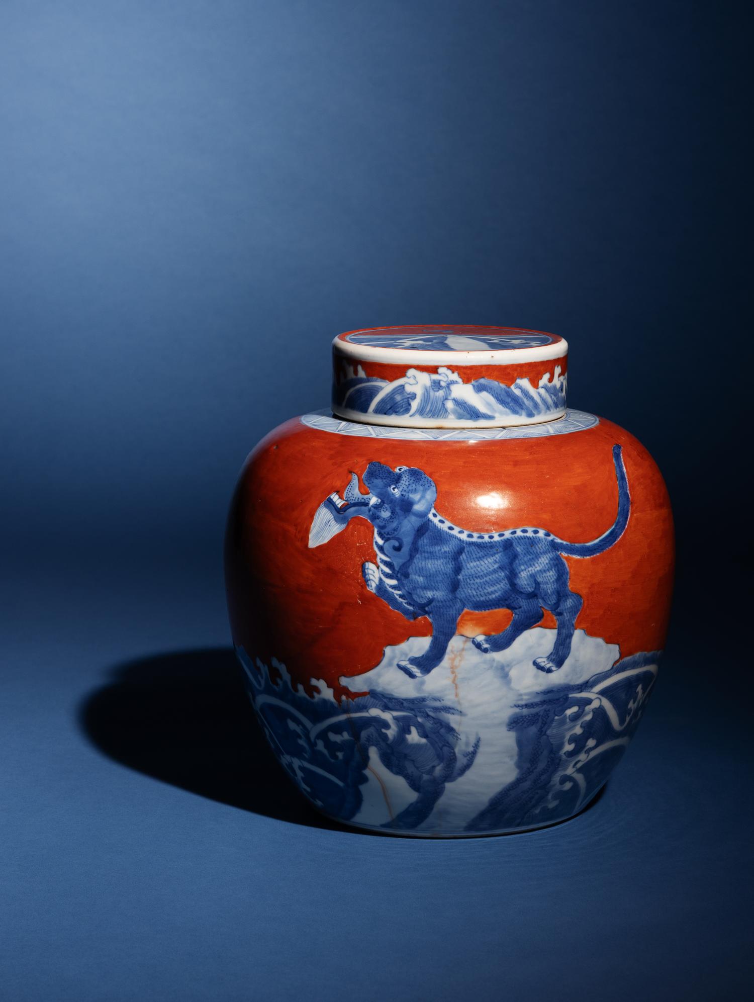 A Chinese Coral-Red Ground Underglaze Blue Porcelain Covered Ginger Jar, 18th Century 清中期 珊瑚紅地青花瑞獸圖蓋罐