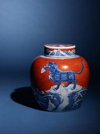 A Chinese Coral-Red Ground Underglaze Blue Porcelain Covered Ginger Jar, 18th Century 清中期 珊瑚紅地青花瑞獸圖蓋罐