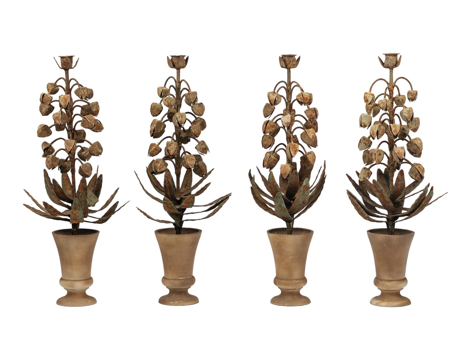 A Set of Four Topiary-Form Candlesticks