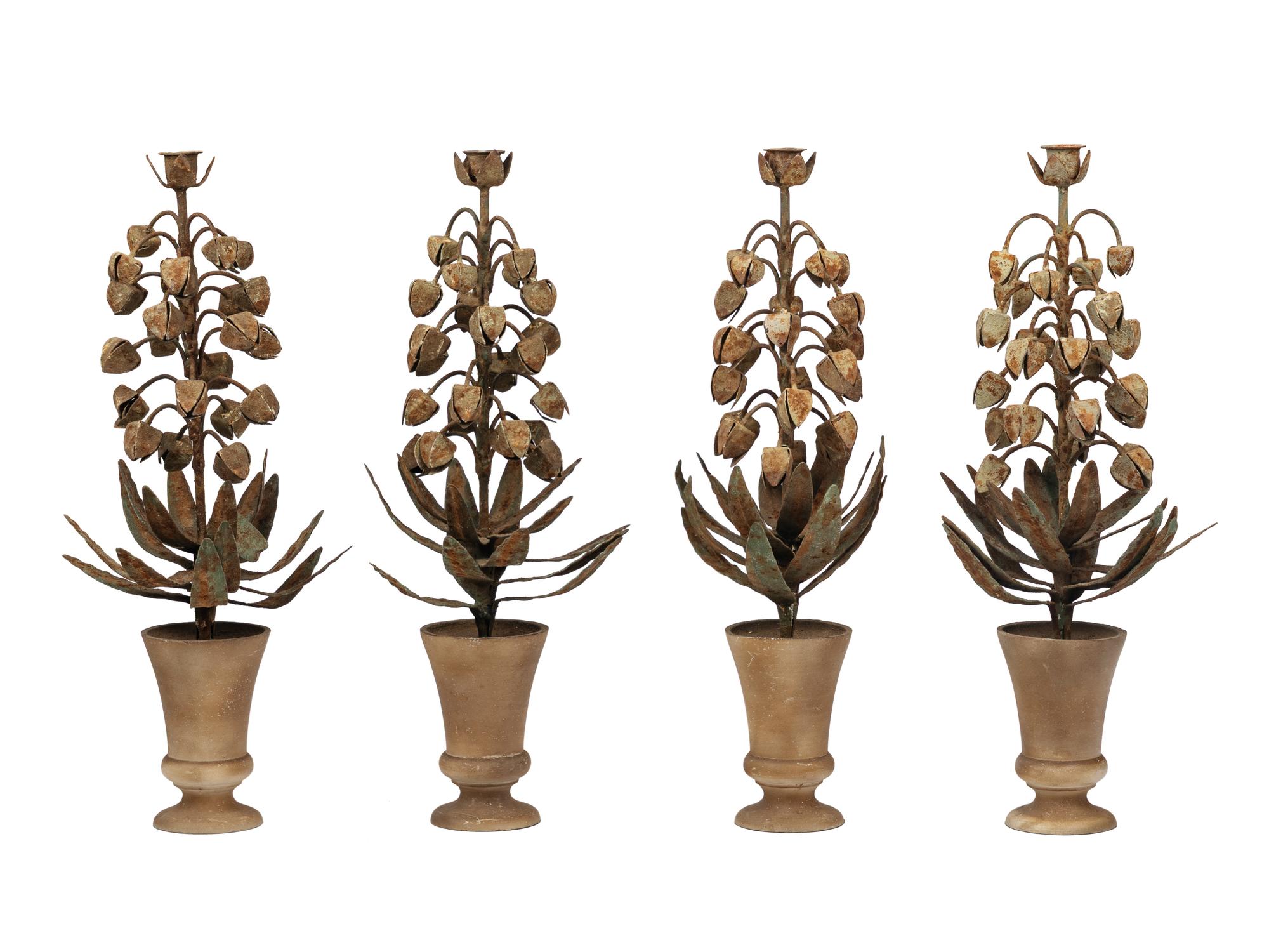 A Set of Four Topiary-Form Candlesticks