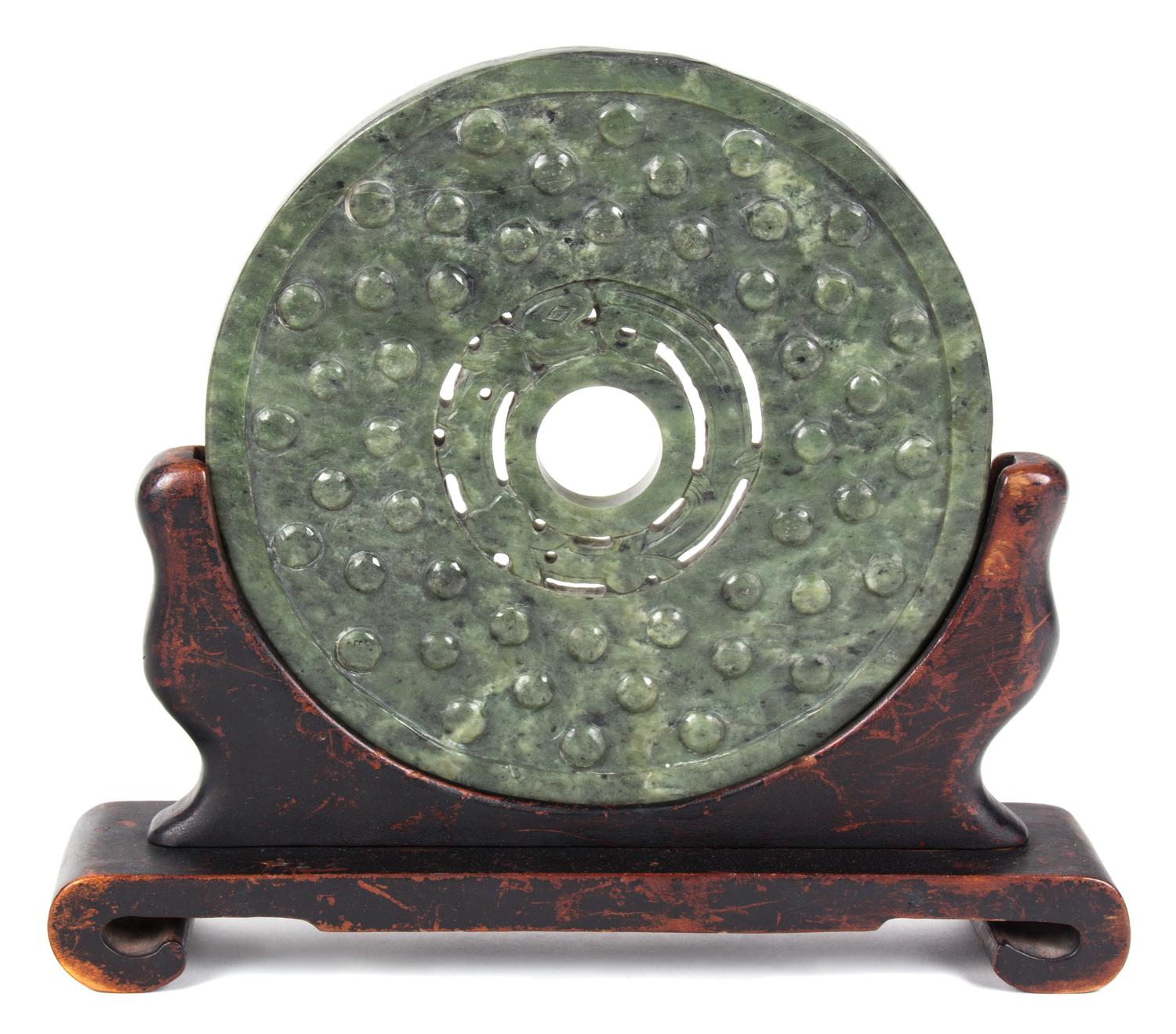 A Large Pierced and Carved Green Jadeite Roundel Height 12 inches.