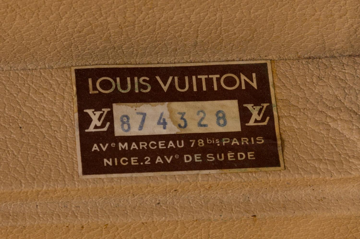 A Louis Vuitton Monogram Canvas Bisten Suitcase, 14"H x 19"W x 6.5"D; Handle drop: 2".