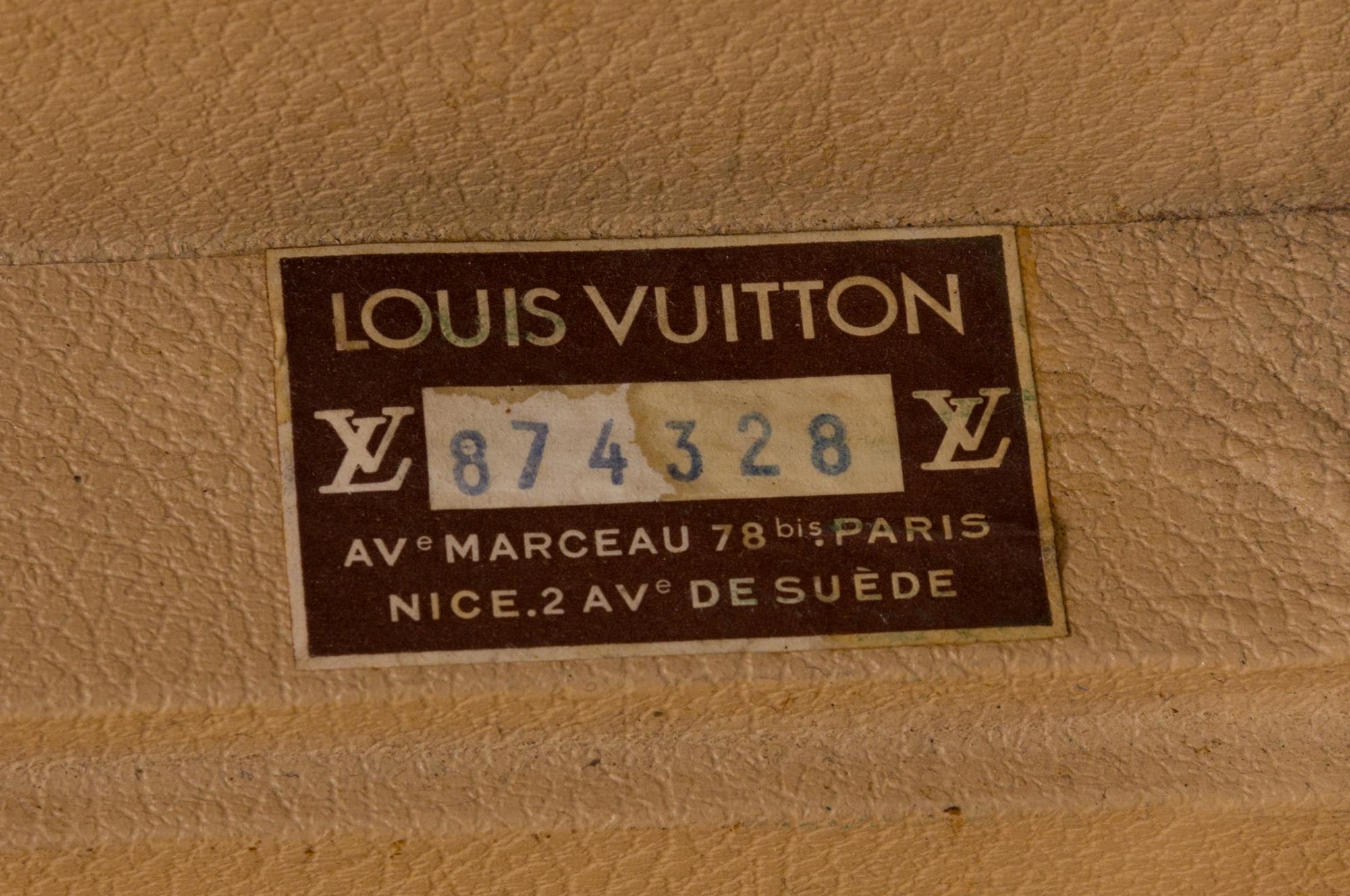 A Louis Vuitton Monogram Canvas Bisten Suitcase, 14"H x 19"W x 6.5"D; Handle drop: 2".