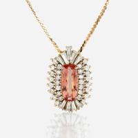 A topaz, diamond, and gold pendant