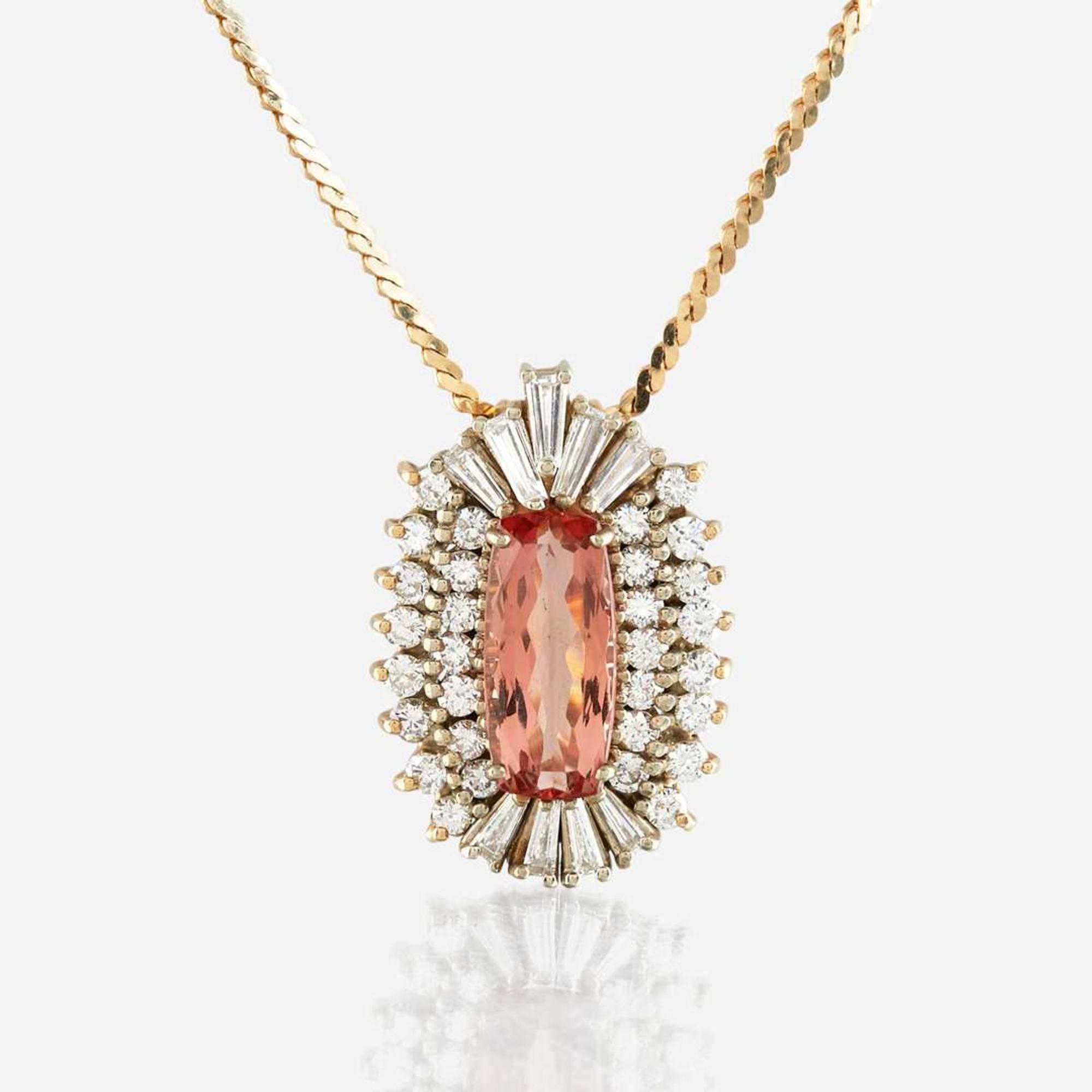 A topaz, diamond, and gold pendant