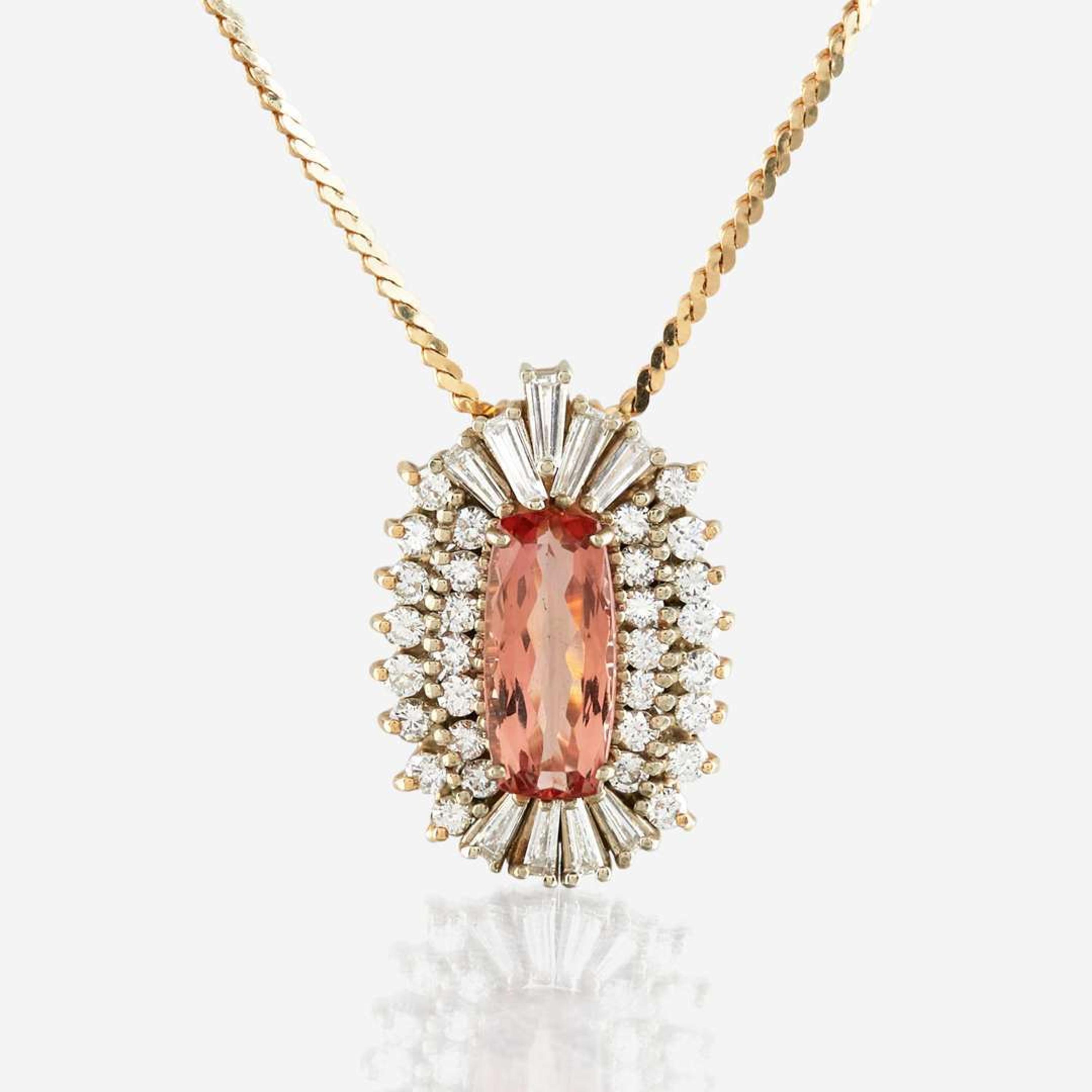 A topaz, diamond, and gold pendant