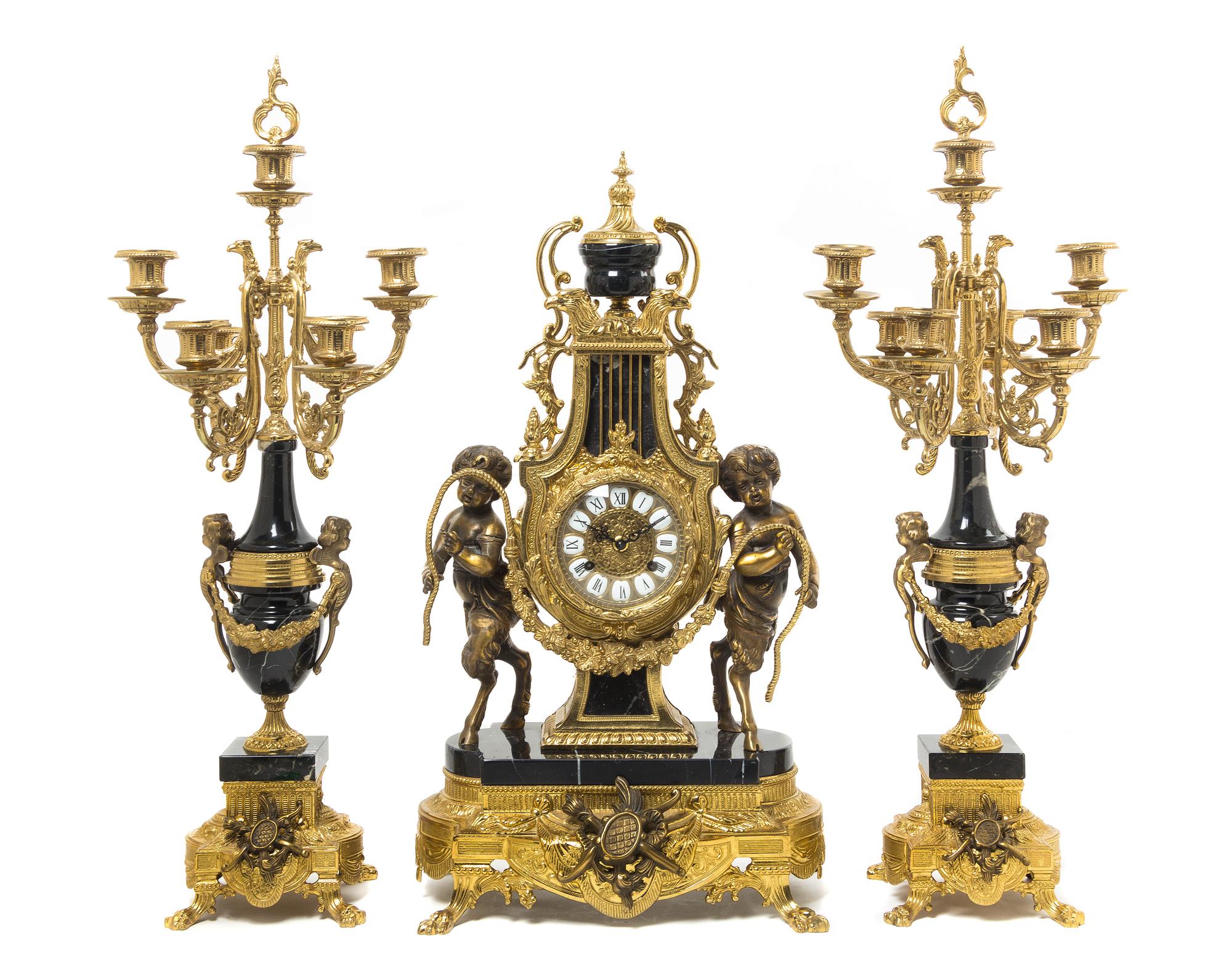 A French Neoclassical Gilt Bronze and Marble Clock Garniture LATE 20TH CENTURY Height of clock 24 1/2 inches. — LATE 20TH CENTURY