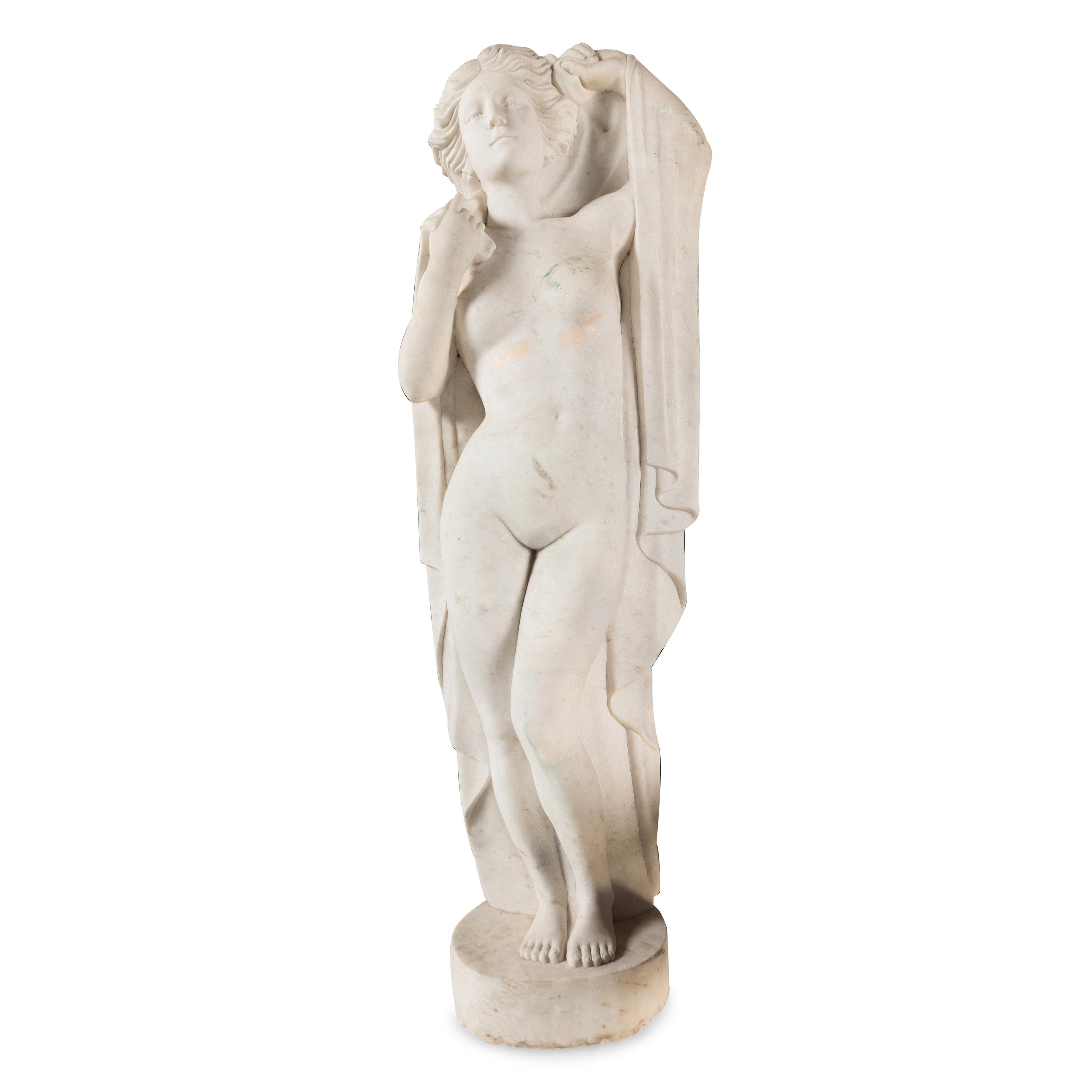 A Carved Marble Figure of a Maiden