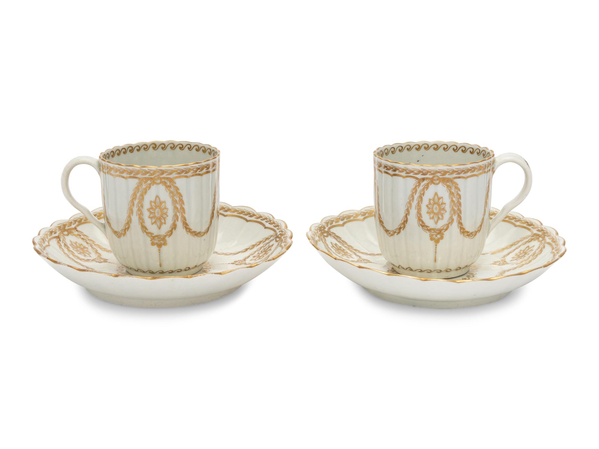 A Pair of Worcester Porcelain Cups and Saucers