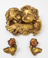 Three Giltwood Putto Masks Height of tallest 12 inches.