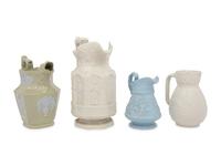 Four English Molded and Glazed Pottery Pitchers