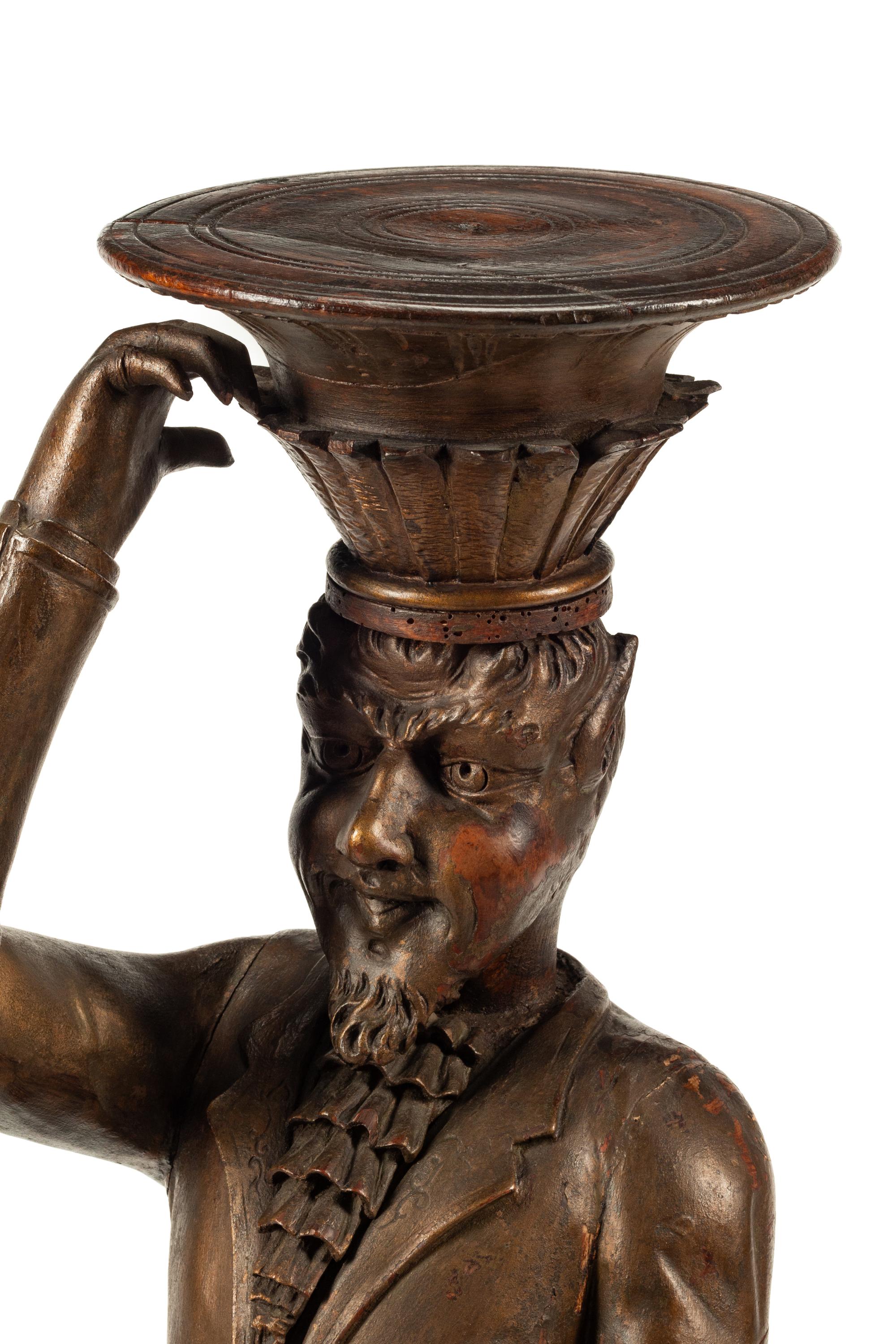 A Venetian Carved Walnut Figural Stand