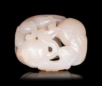 A White Jade Carving of Squirrel and Peaches