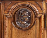 A Small Italian Carved Walnut Cabinet