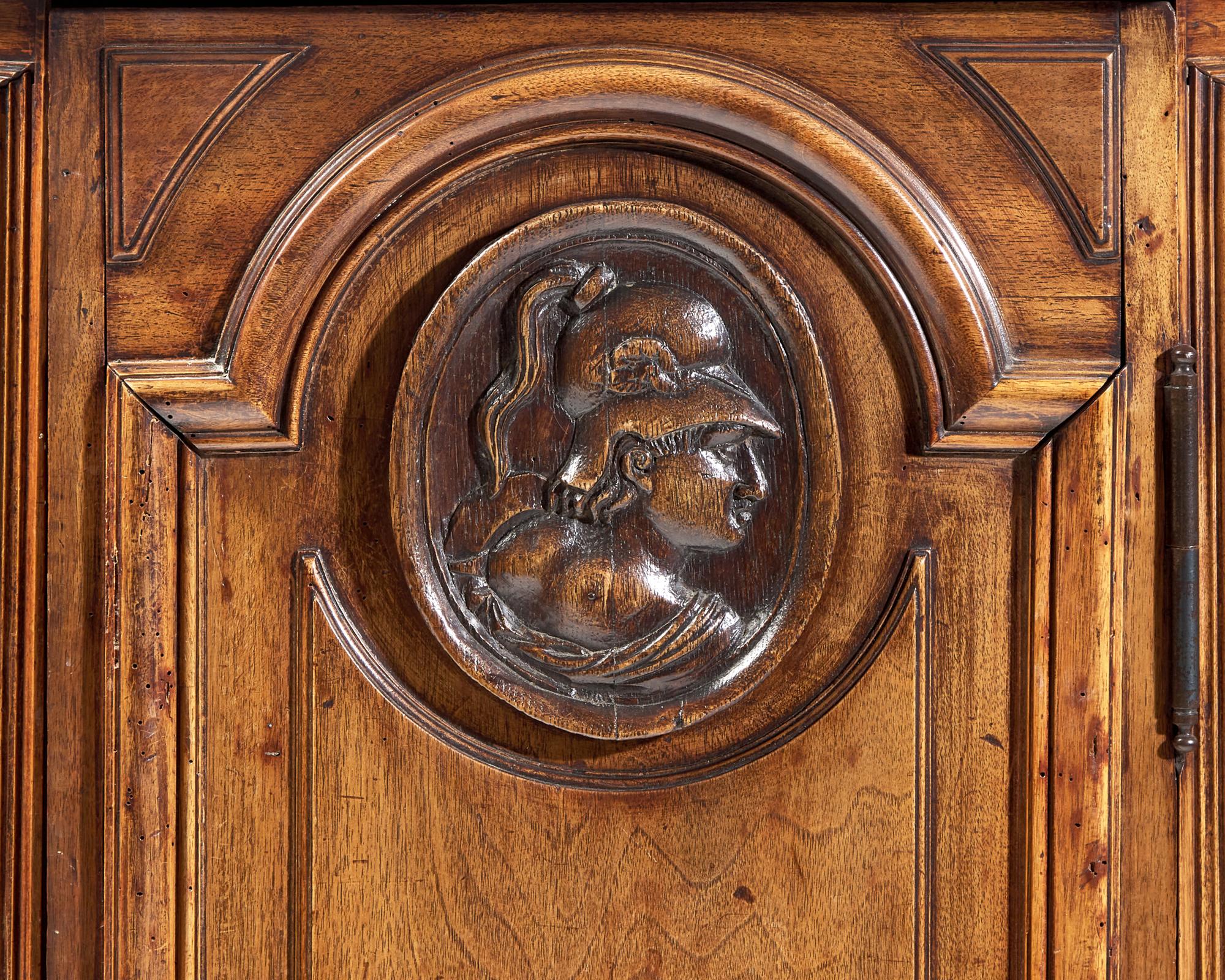 A Small Italian Carved Walnut Cabinet