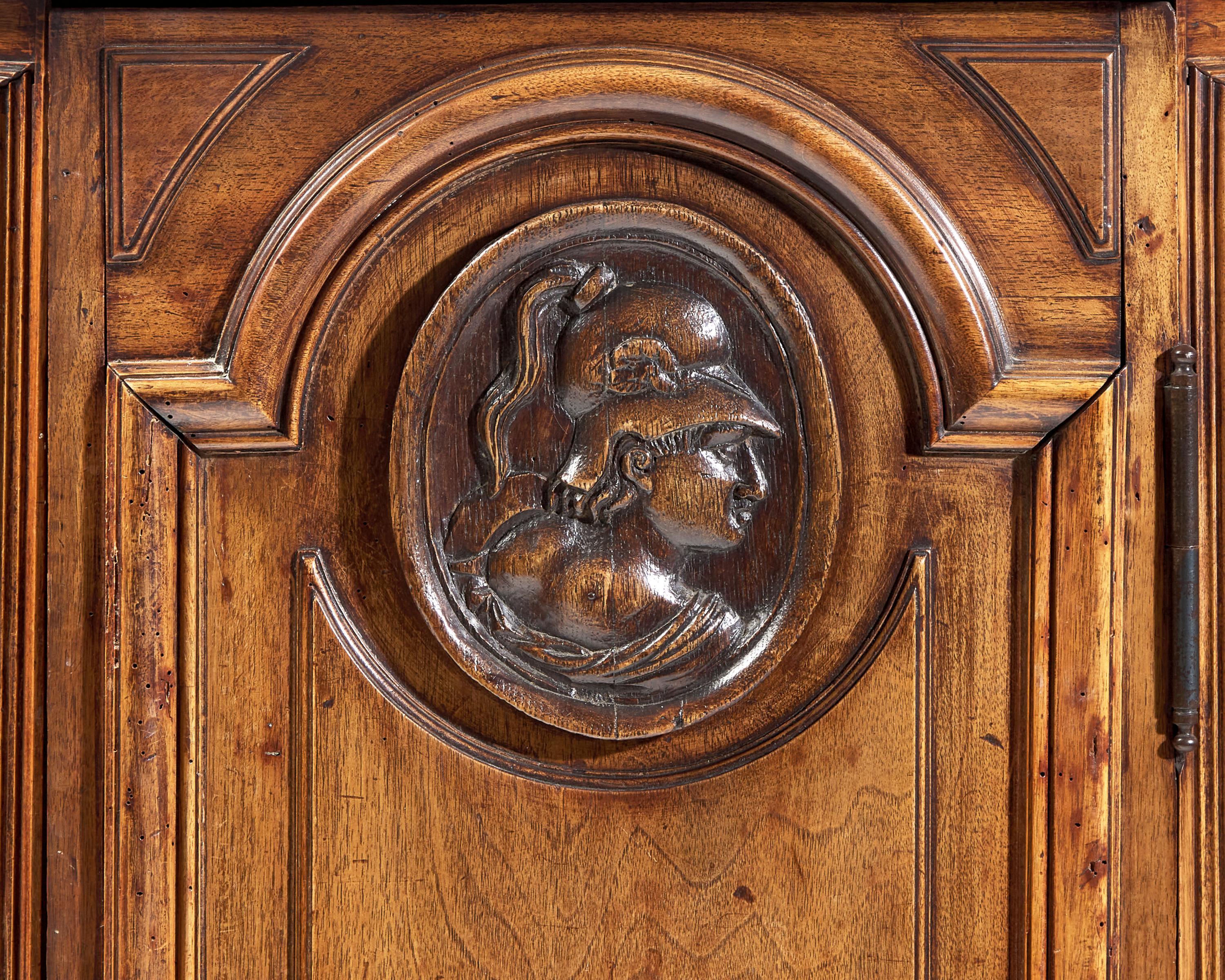 A Small Italian Carved Walnut Cabinet