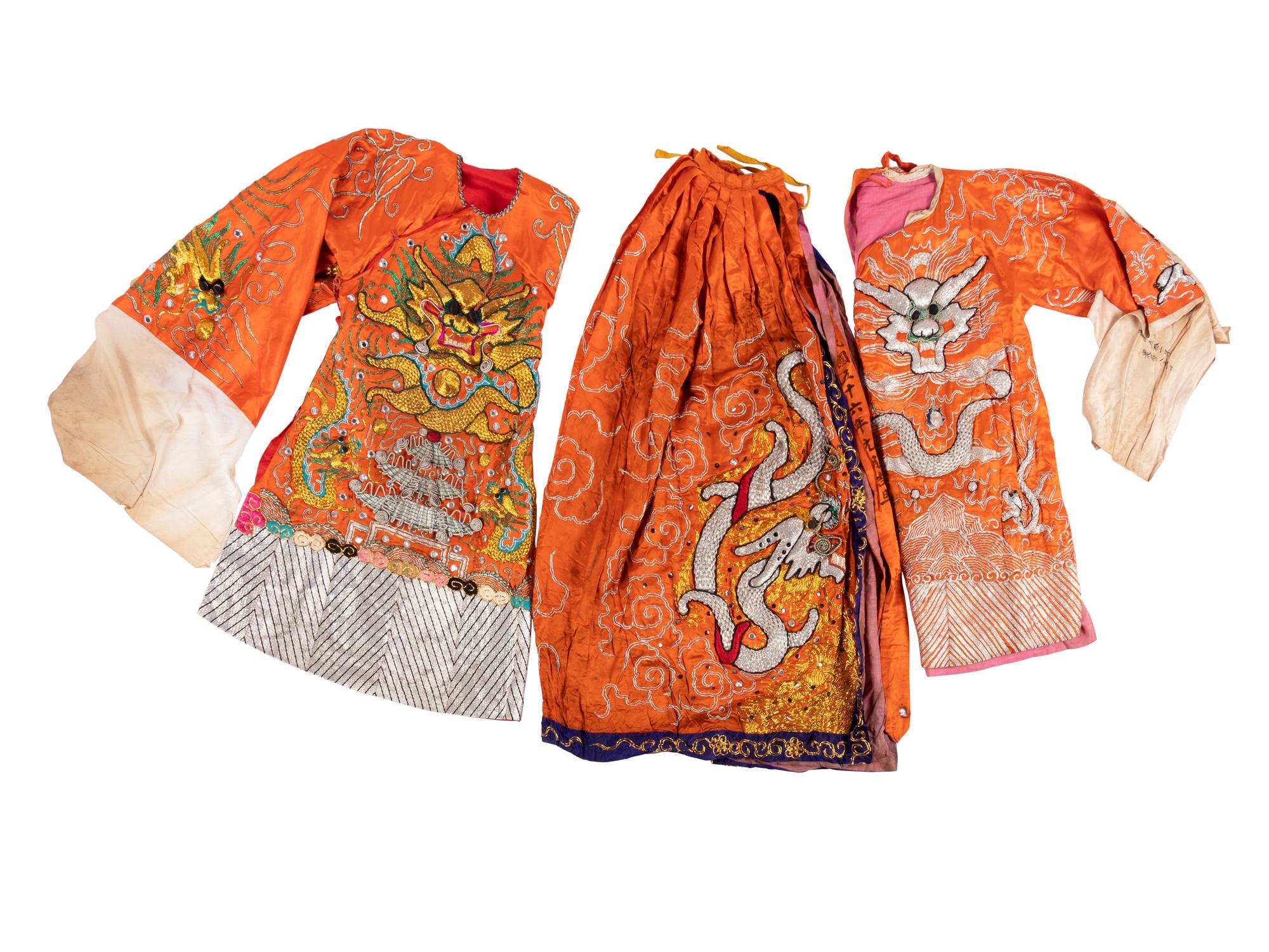 Two Chinese Orange Ground Embroidered Silk Theatrical Robes and A Cape