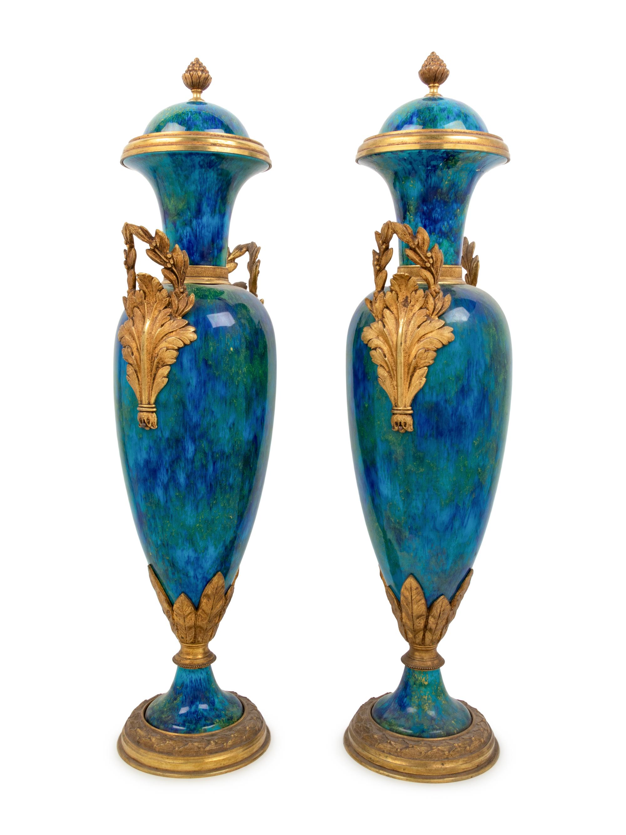 A Pair of Sèvres Style Gilt Bronze Mounted Flambe Glazed Urns