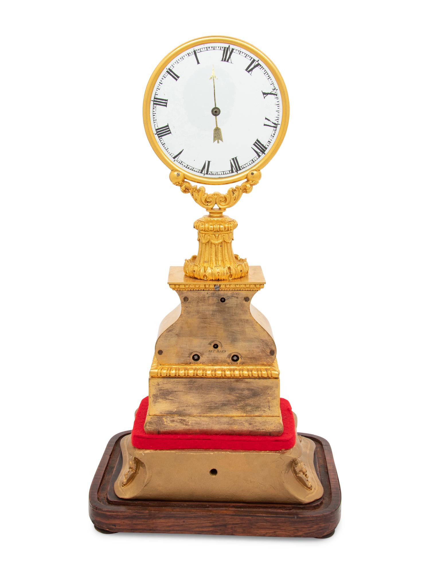 A Louis Philippe Gilt Bronze Mystery Clock