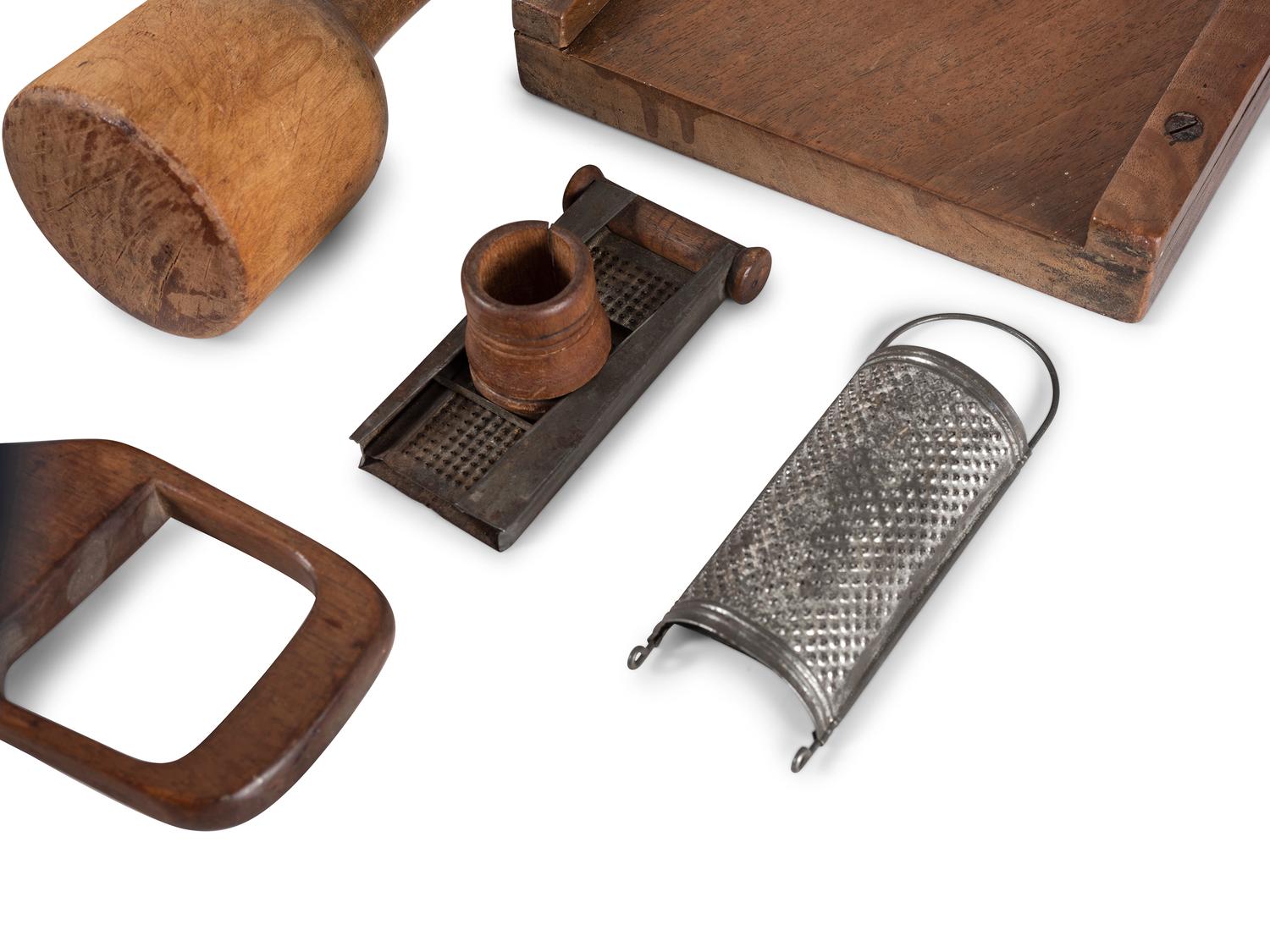 A Group of Wood and Tin Graters, Slicers and Pounders
